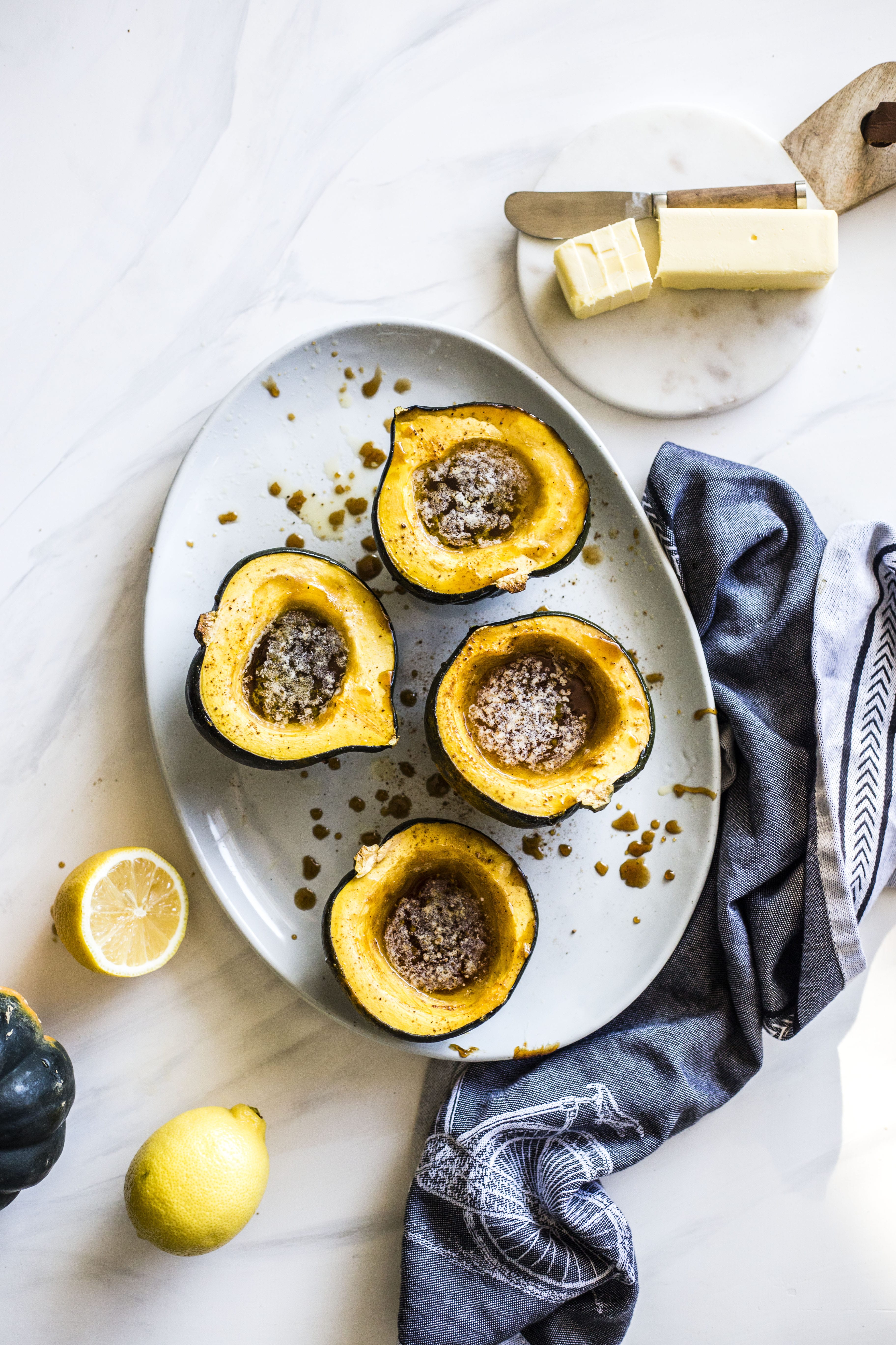 This baked acorn squash recipe is so delicious for the fall! It's made with vanilla and bourbon, finished with balsamic, is super easy, a bit indulgent and perfect for the season. Makes for a fabulous side dish in autumn or even a dessert! I howsweeteats.com #acorn #squash #baked #vanilla #bourbon