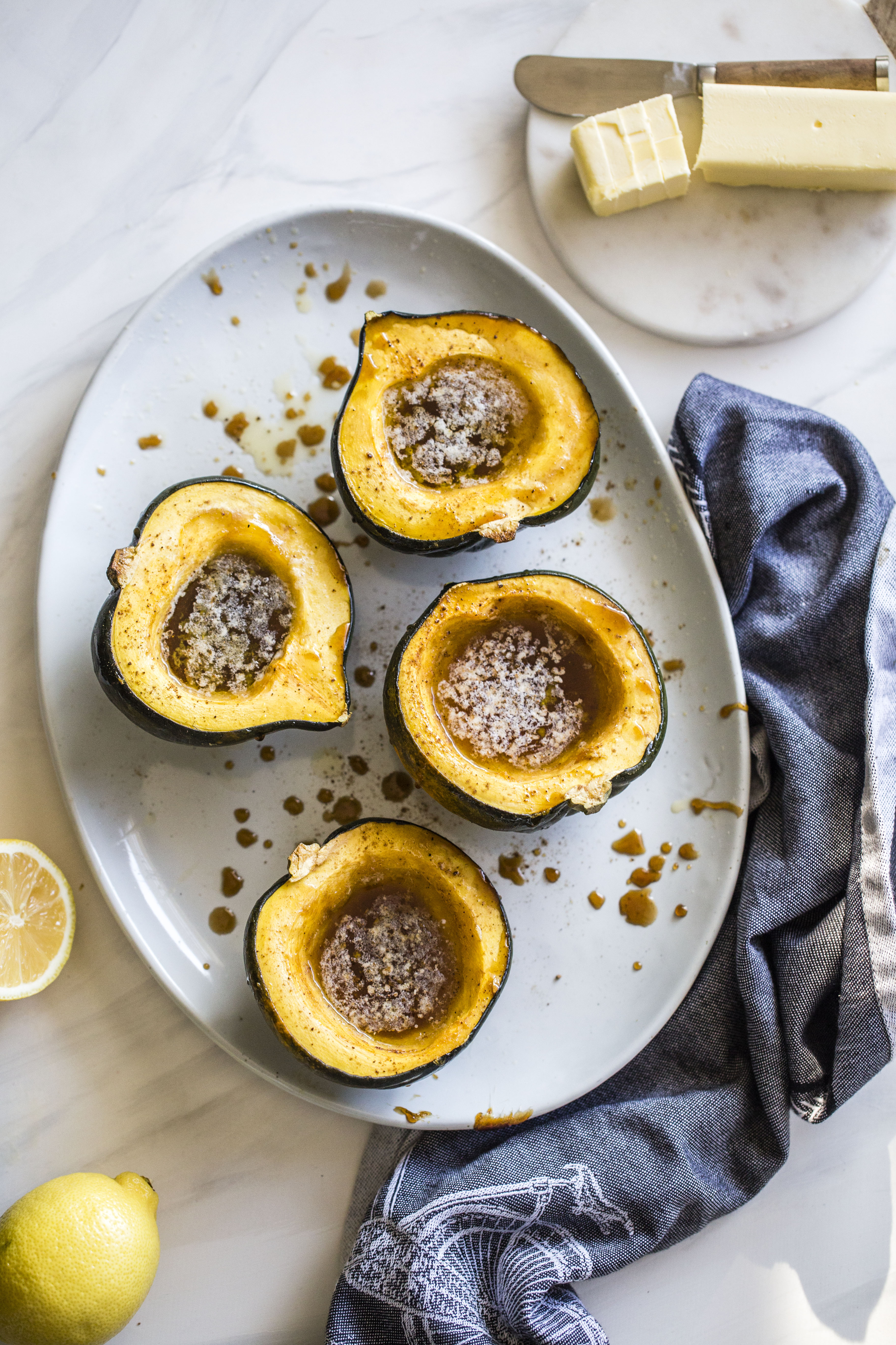 This baked acorn squash recipe is so delicious for the fall! It's made with vanilla and bourbon, finished with balsamic, is super easy, a bit indulgent and perfect for the season. Makes for a fabulous side dish in autumn or even a dessert! I howsweeteats.com #acorn #squash #baked #vanilla #bourbon