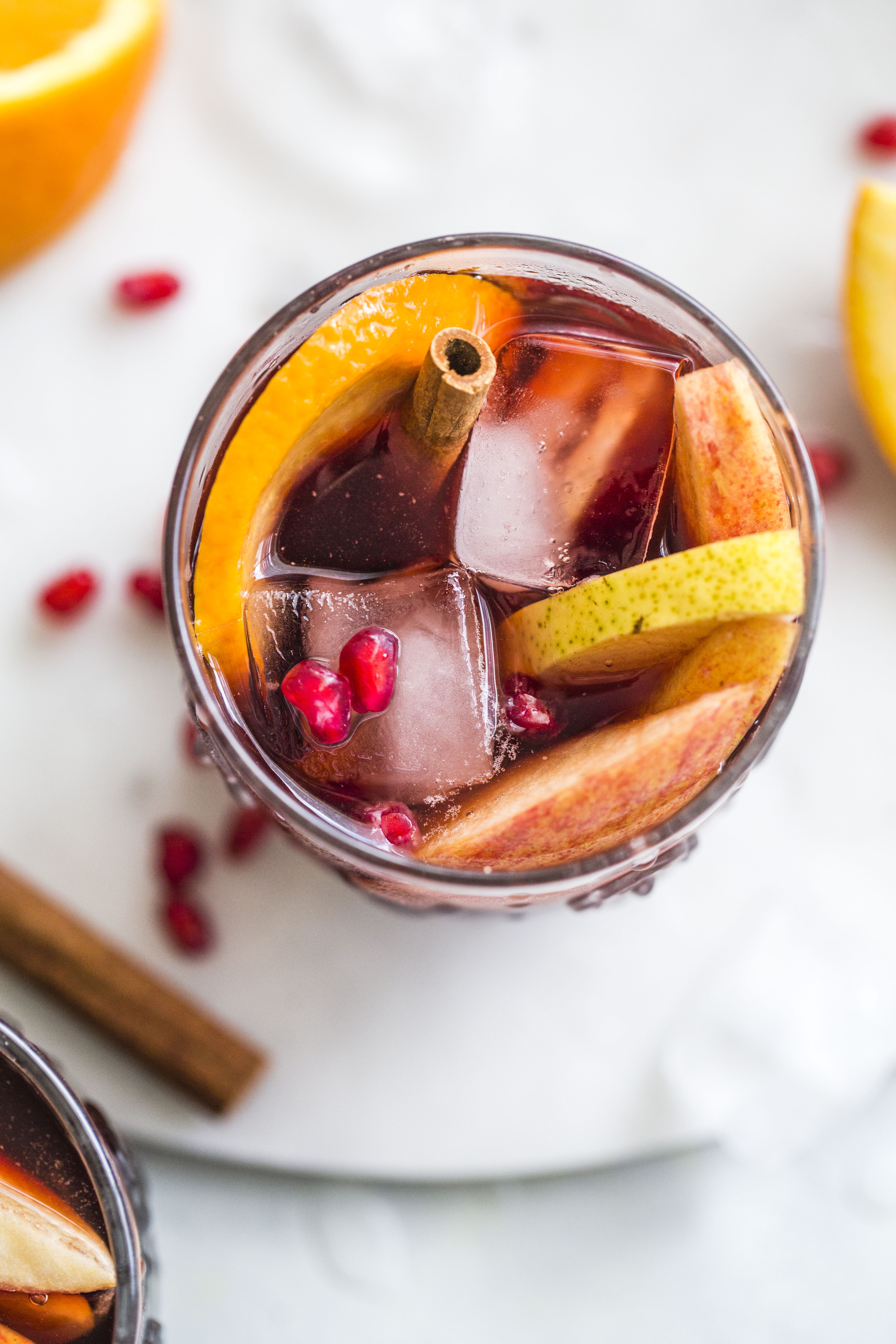 Pomegranate sangria is the best winter sangria ever! It comes in the form of delicious pomegranate vanilla sangria with lots of red wine and brandy. It's perfect for the cooler months and it will warm you right up. I howsweeteats.com #pomegranate #sangria