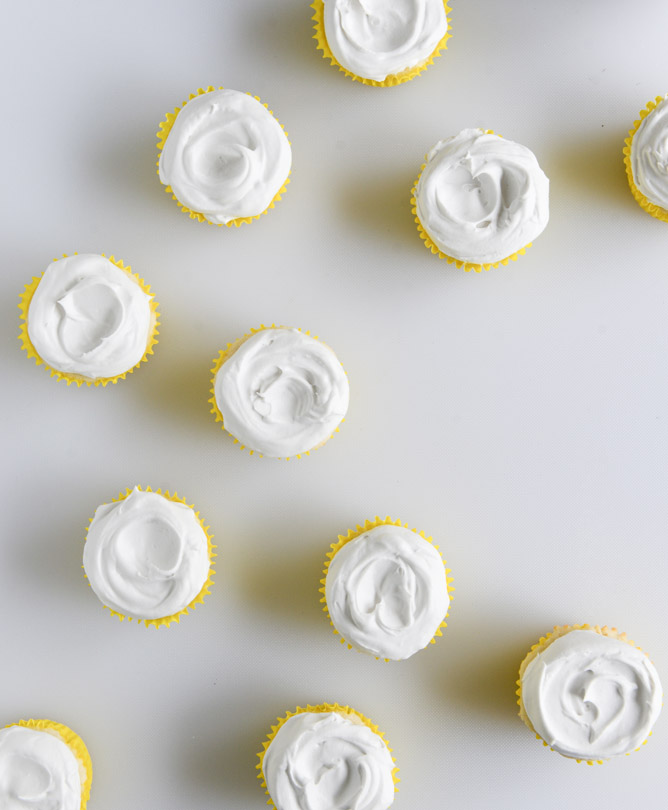 Fluffy Lemon Cupcakes with Whipped Coconut Cream I howsweeteats.com