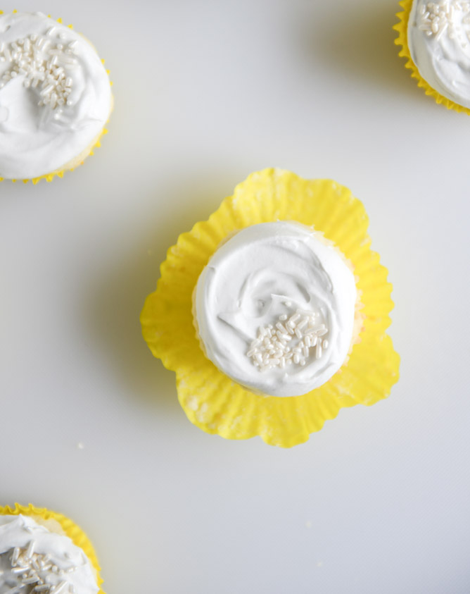 Fluffy Lemon Cupcakes with Whipped Coconut Cream I howsweeteats.com