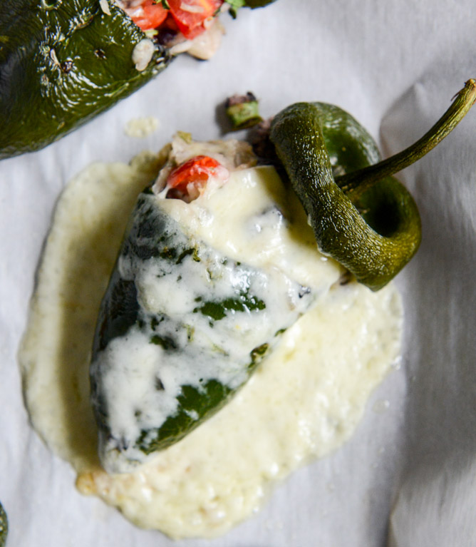 cheese smothered stuffed poblanos I howsweeteats.com