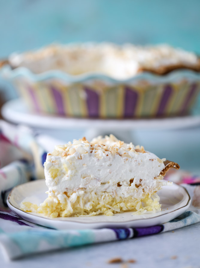 coconut custard pie with coconut whipped cream I howsweeteats.com