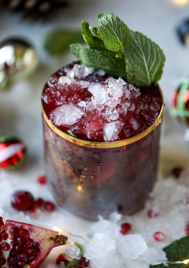 cranberry pomegranate juleps I howsweeteats.com #cocktails #christmas #cranberry #pomegranate #mintjulep