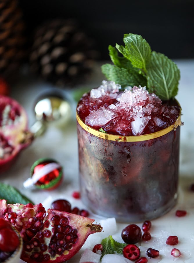 cranberry pomegranate juleps I howsweeteats.com #cocktails #christmas #cranberry #pomegranate #mintjulep