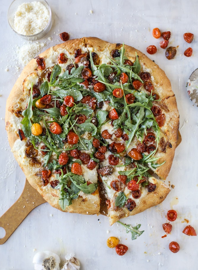 slow roasted cherry tomato pizza with garlic cream and arugula I howsweeteats.com #pizza #recipes