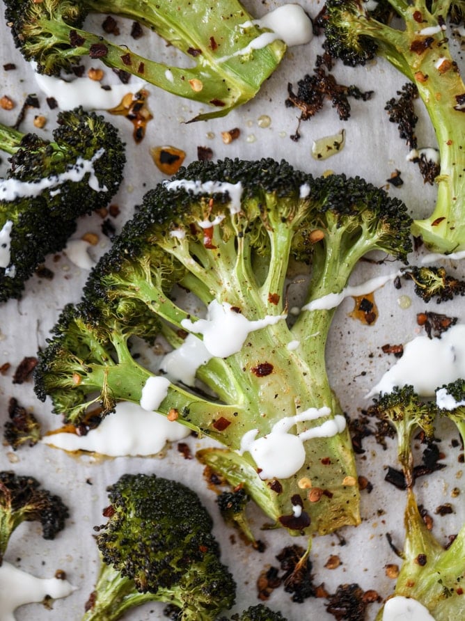 best roasted broccoli with goat cheese drizzle I howsweeteats.com #broccoli #roasted #goatcheese #spicy #lemon