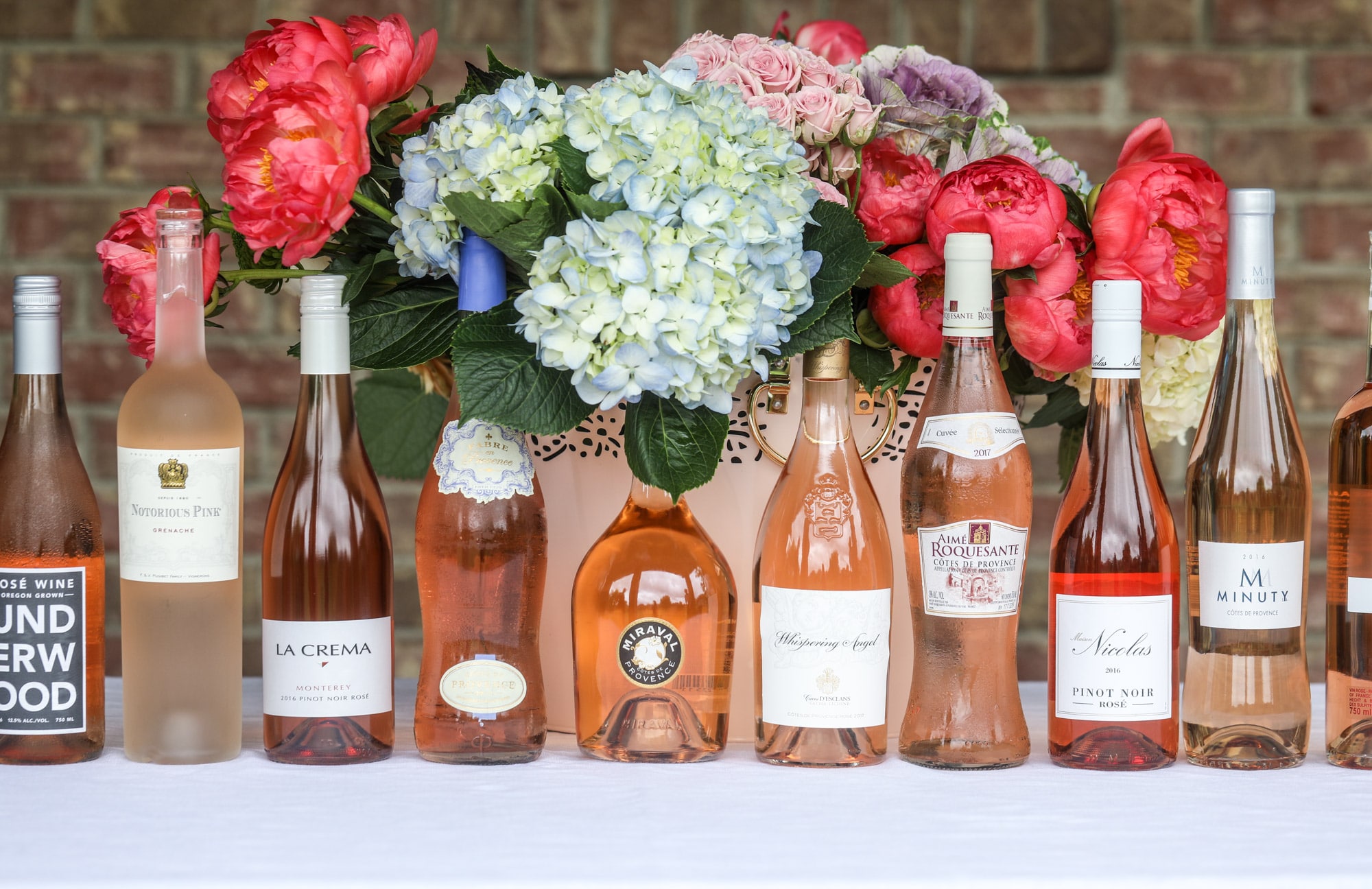 The best rosé to drink - all here in one epic summer guide for you! I'm sharing my personal favorite top ten rosé wines to drink in summer 2018, along with the perfect cheese board and snacks to go with. I howsweeteats.com #rosé #rose #summer #2018 #cheeseboard 