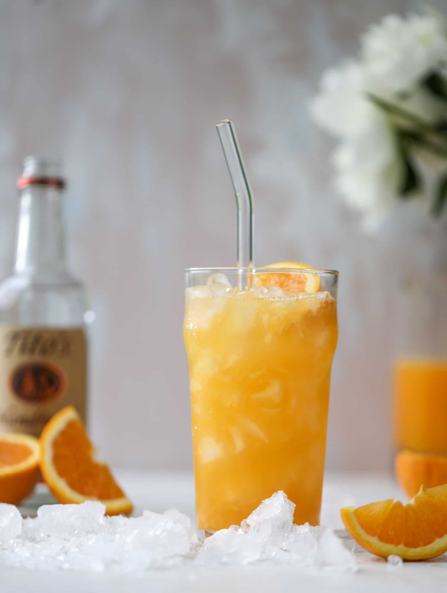 This orange crush is a copycat cocktail from the ones served in Ocean City, Maryland at the beach all summer long! It's one entire freshly squeezed orange with vodka and lemon lime soda and it tastes like heaven. Super refreshing and perfect for summer. I howsweeteats.com #orange #crush #cocktail #ocean #city #vodka