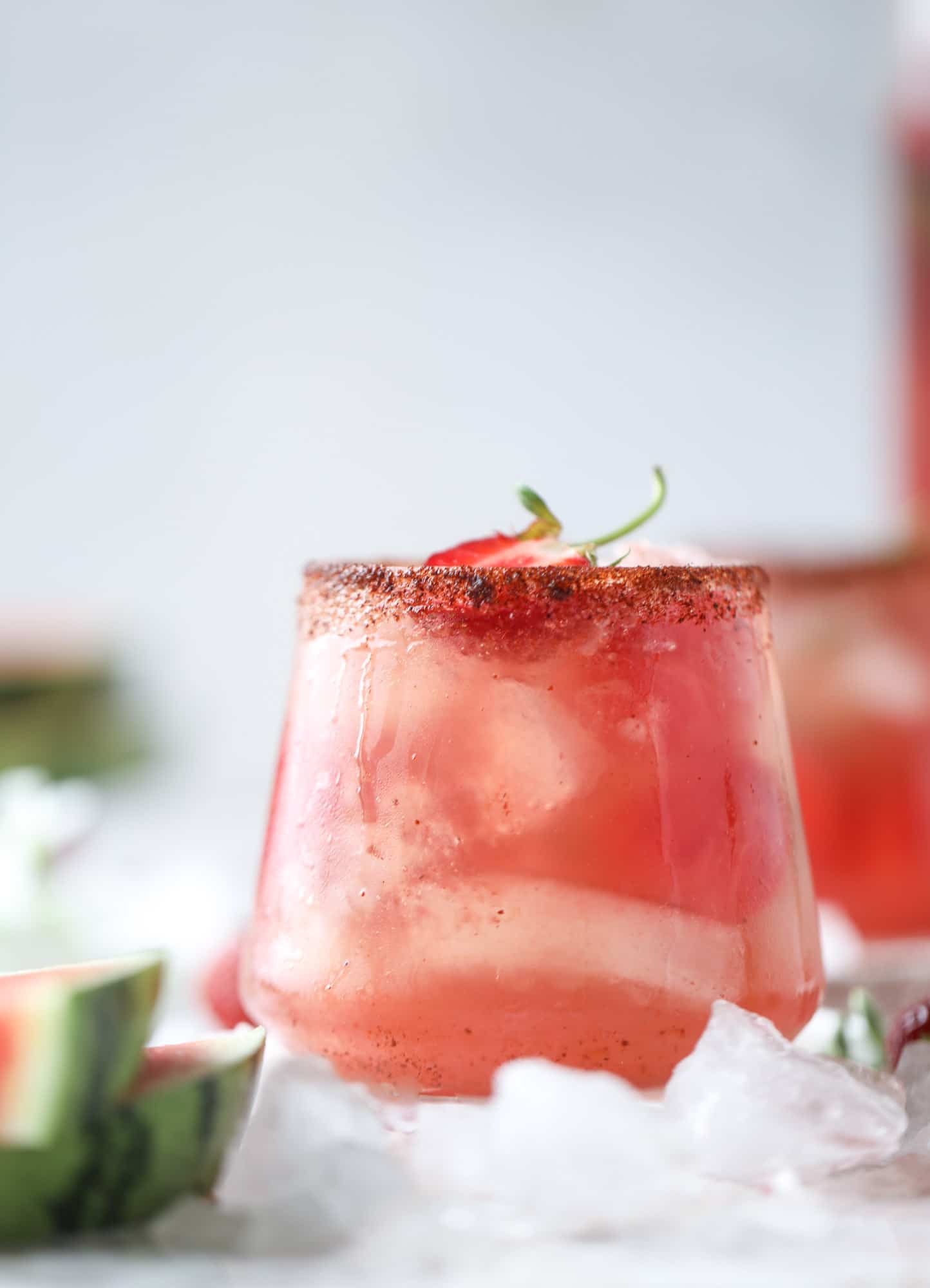 This spicy watermelon sangria is super refreshing, light, delicious and perfect for a hot summer day! Complete with an entire bottle of rosé, watermelon juice, melon balls, strawberries and brandy, this is the best summer cocktail in a pitcher! I howsweeteats.com #spicy #watermelon #sangria #cocktails #rosé