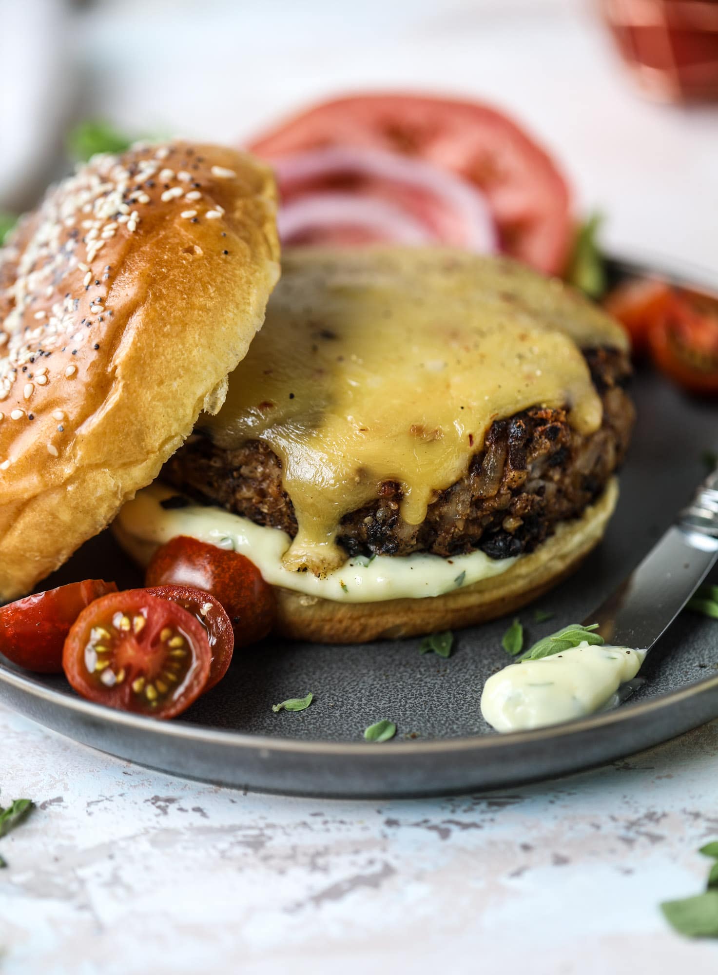This is the best ever veggie burger and that is not an exaggeration! It's delicious, full of texture and chew, super satisfying and actually sticks together in the pan. You can serve it on buns, make a patty melt, a salad or lettuce wraps - perfection! I howsweeteats.com #best #veggie #burger #vegetarian #beans #quinoa