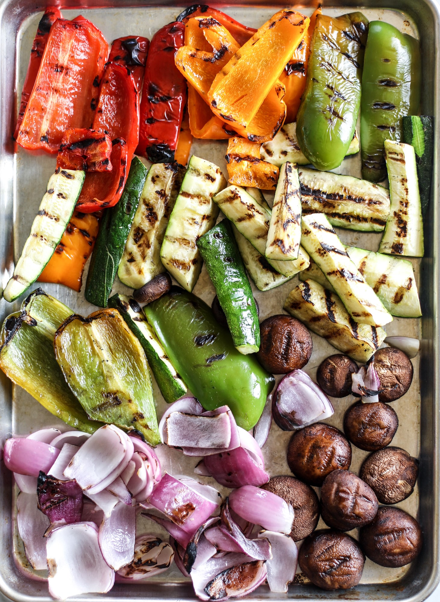 These are the best grilled vegetables ever! You grill your veggies and chop them into the perfect bite, then drizzle them with a fabulous fresh basil vinaigrette. Delish! It doesn't end there; serve these with grilled garlic toast and everyone will freak! I howsweeteats.com #best #grilled #vegetables #veggies #basil #bread