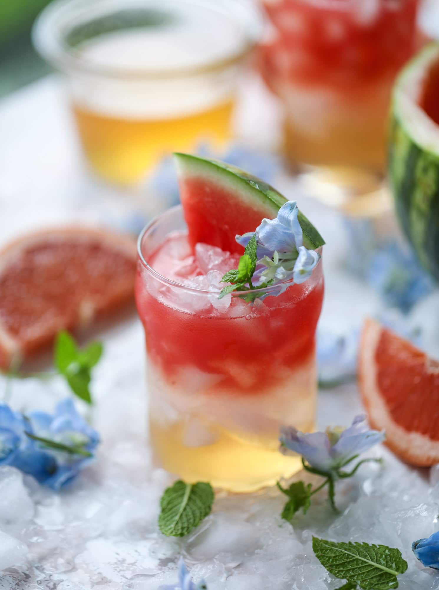 This watermelon grapefruit paloma cocktail is a summertime dream! Grapefruit syrup is super easy to make and when it's combined with fresh watermelon juice and tequila... oooh! Best happy hour ever. I howsweeteats.com #grapefruit #watermelon #paloma #cocktail #tequila