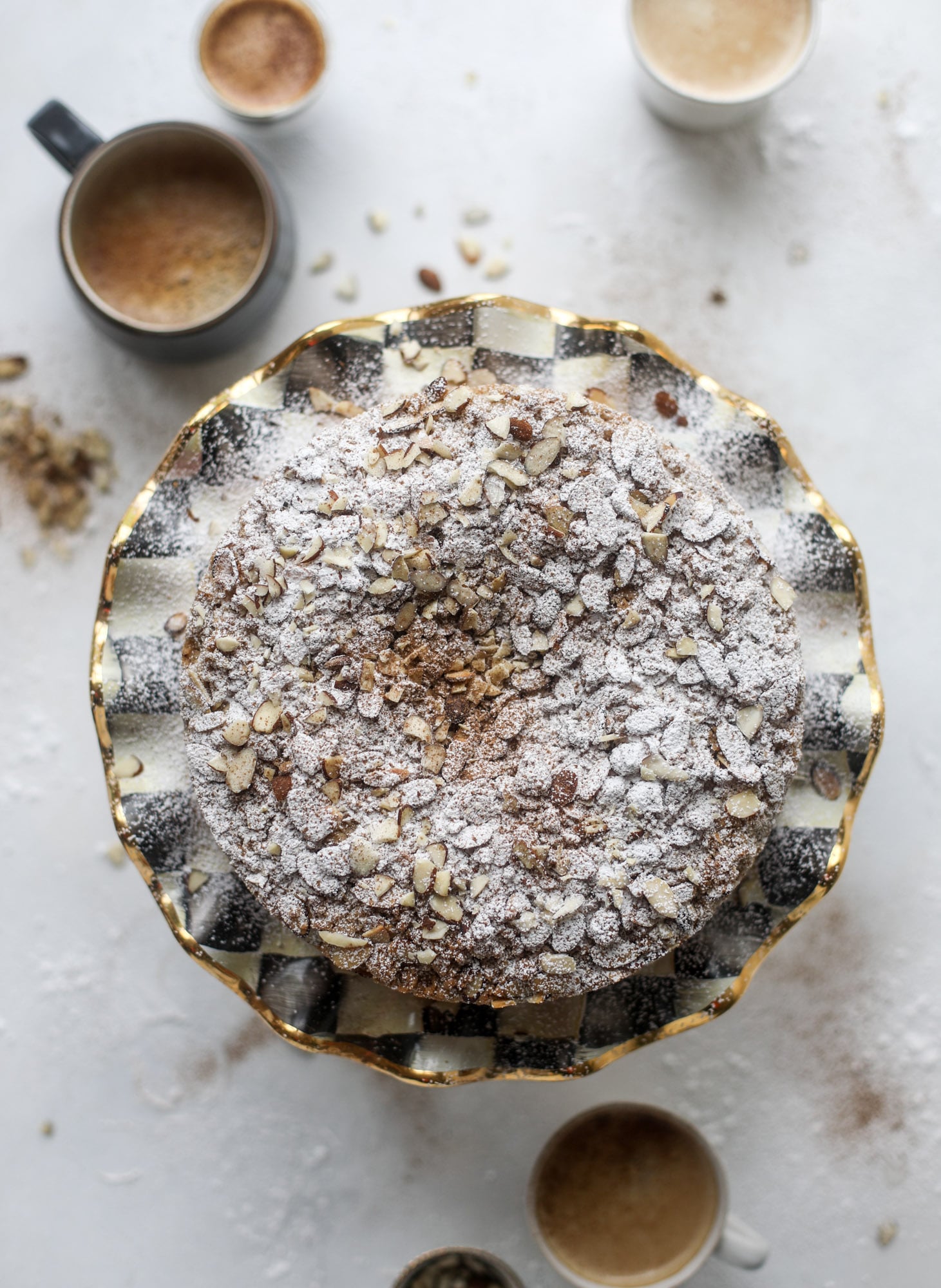 This almond crumb cake is so delicious and perfect for breakfast or dessert! It's full of delicious almond flavor and crunch and the crumb on top is so thick and perfect. It's like an almond croissant on steroids. I howsweeteats.com #almond #crumb #cake