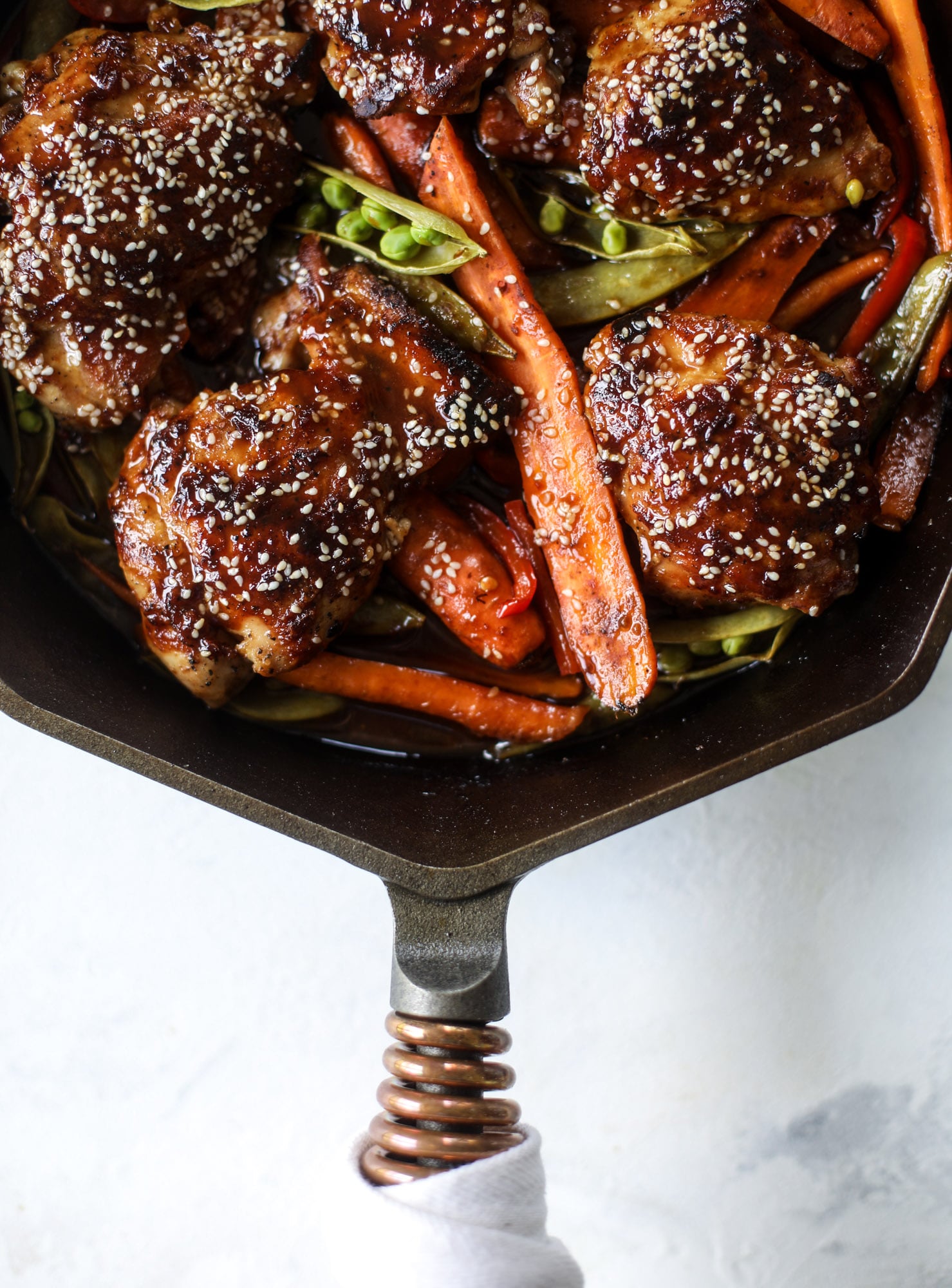 This one pan sesame chicken and veggies is so easy and delicious! It's the perfect weeknight meal that is packed with flavor. The chicken and veggies are great on their own but also wonderful when paired with brown rice or quinoa! I howsweeteats.com #one #pan #sesame #chicken #dinner #easy