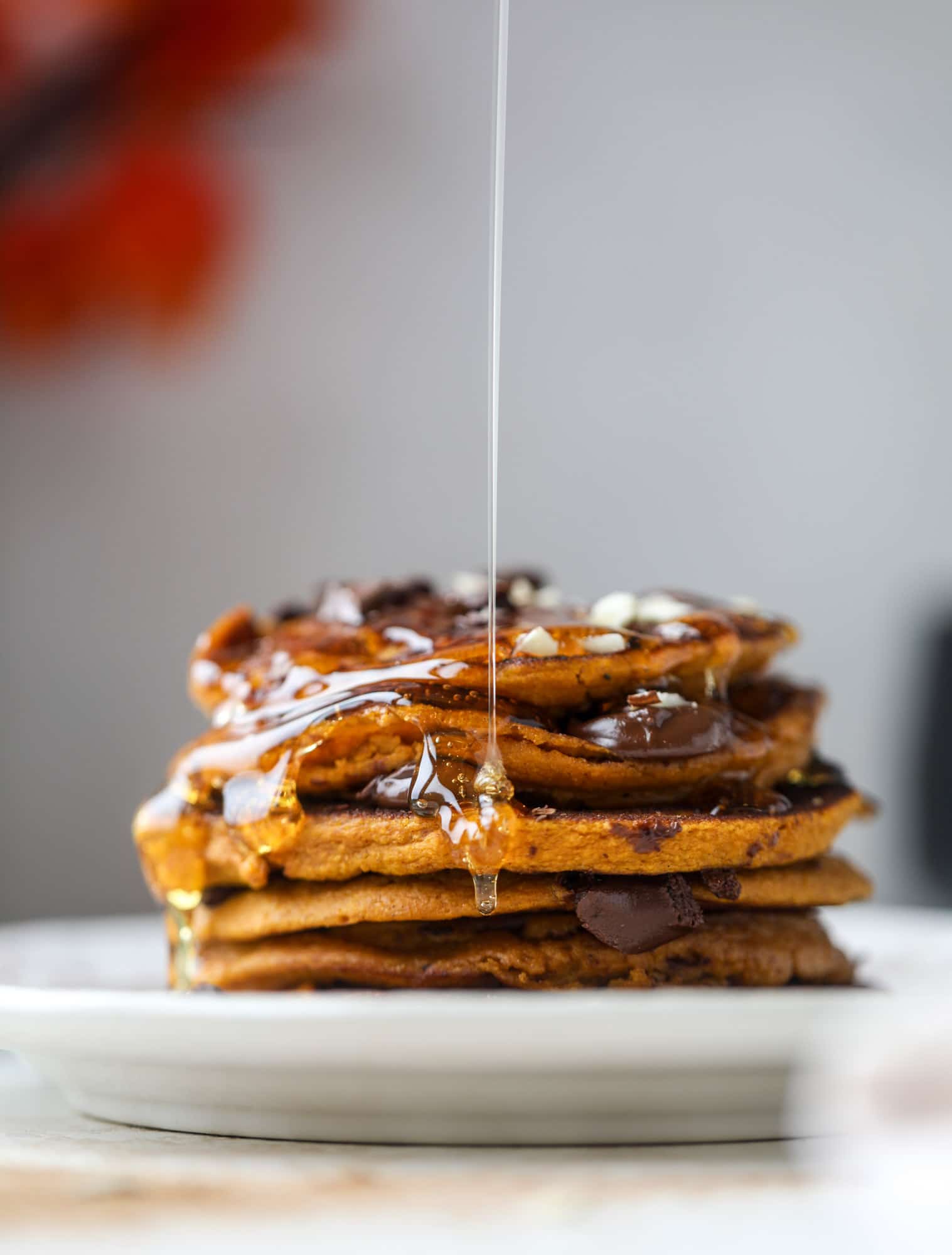These pumpkin protein pancakes are packed with delicious ingredients to make a healthy and satisfying fall breakfast! They are super easy - you throw everything into a blender to create the most incredible protein pancakes! I howsweeteats.com #protein #pancakes #pumpkin #breakfast #fall