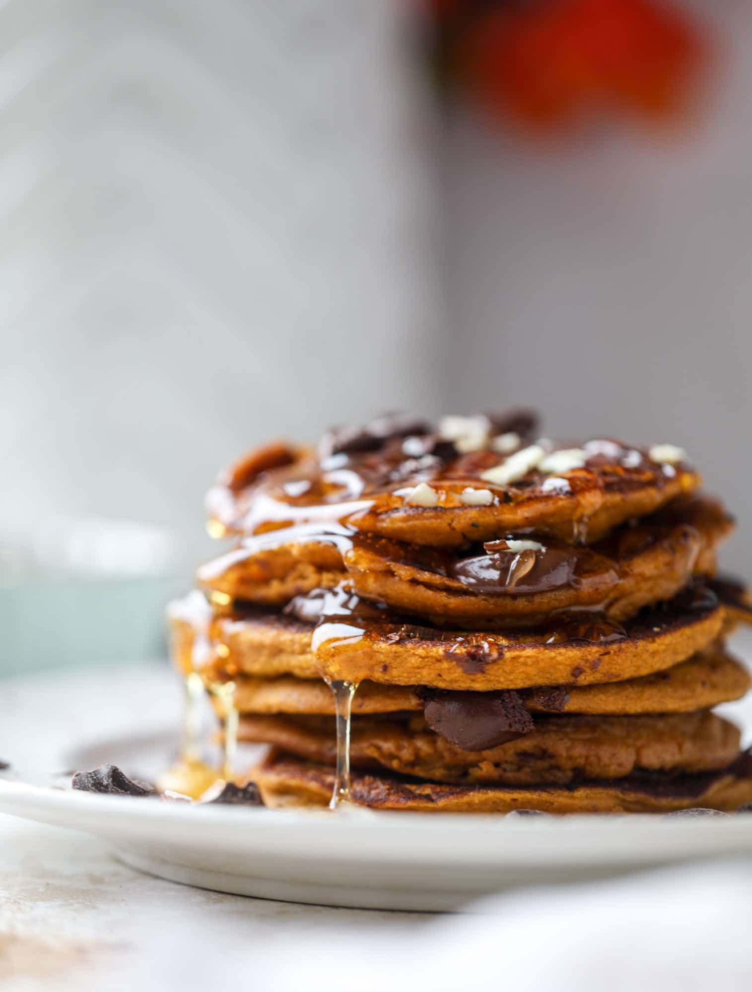 These pumpkin protein pancakes are packed with delicious ingredients to make a healthy and satisfying fall breakfast! They are super easy - you throw everything into a blender to create the most incredible protein pancakes! I howsweeteats.com #protein #pancakes #pumpkin #breakfast #fall