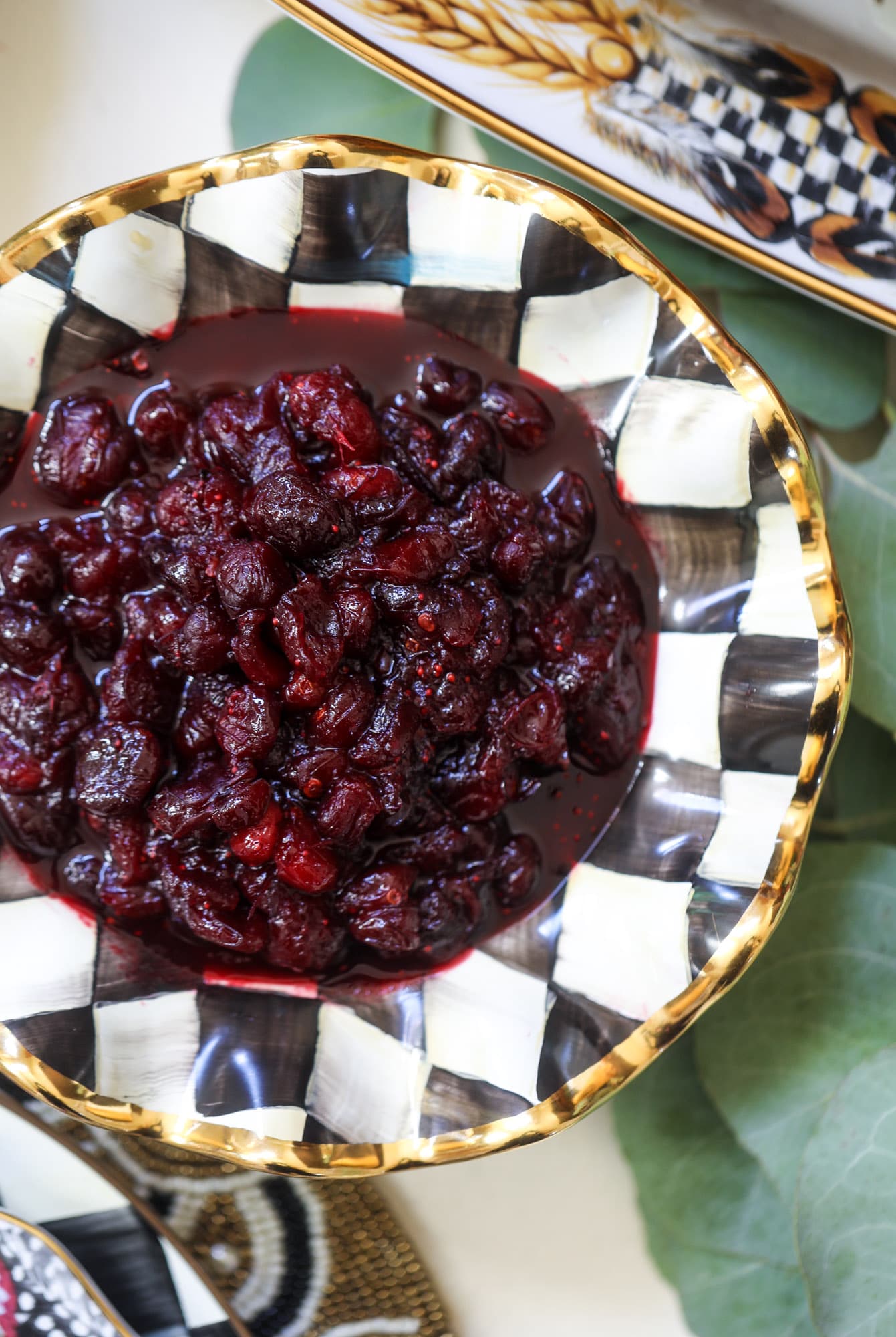 This cranberry chutney is not your traditional Thanksgiving side dish! Chipotle peppers and adobo sauce give this cranberry chutney a little kick - a touch of heat that works so well with the sweet. As a side or spread on sandwiches, it's perfect for the holidays! I howsweeteats.com #cranberry #chutney