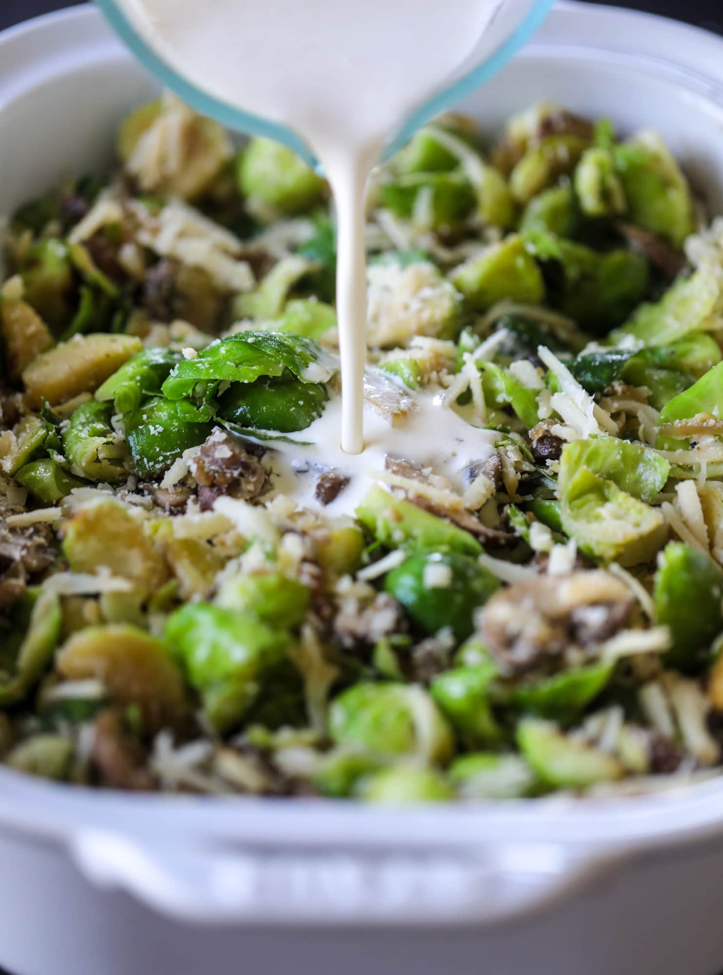 This brussels sprouts gratin is heaven in a dish! It's super flavorful, delicious and comes together to create a fabulous side dish for Thanksgiving or the holidays. Pancetta and cheese turn this in to flavor town - you won't be able to stop eating it! I howsweeteats.com #brusselssprouts #gratin