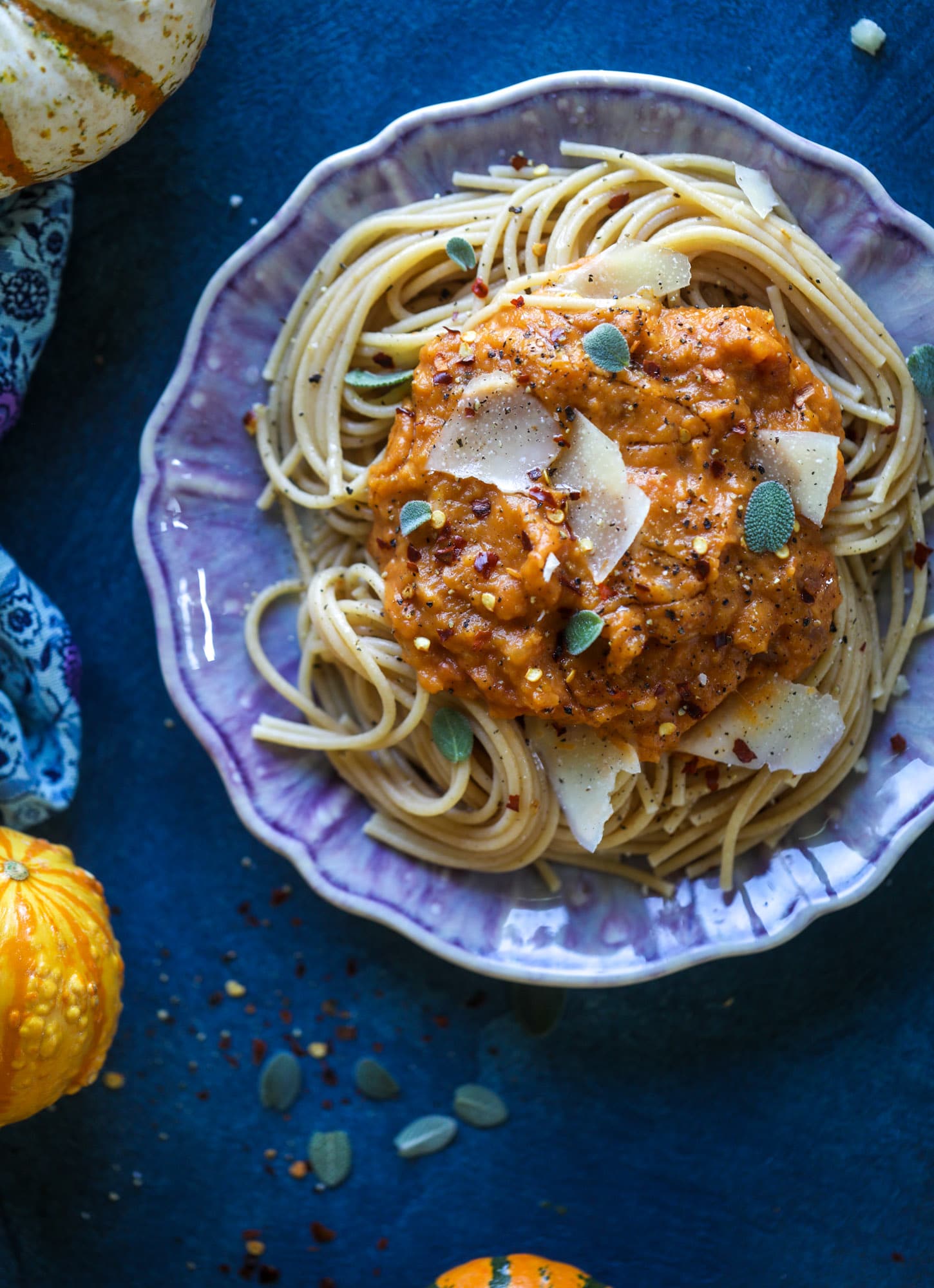 This butternut squash pasta sauce is heaven for an October dinner! Fire roasted tomatoes, butternut squash, pumpkin, sage, spice and parmesan all come together to create a delicious, simmered pot of sauce to blanket your favorite pasta! I howsweeteats.com #butternut #squash #pasta #sauce