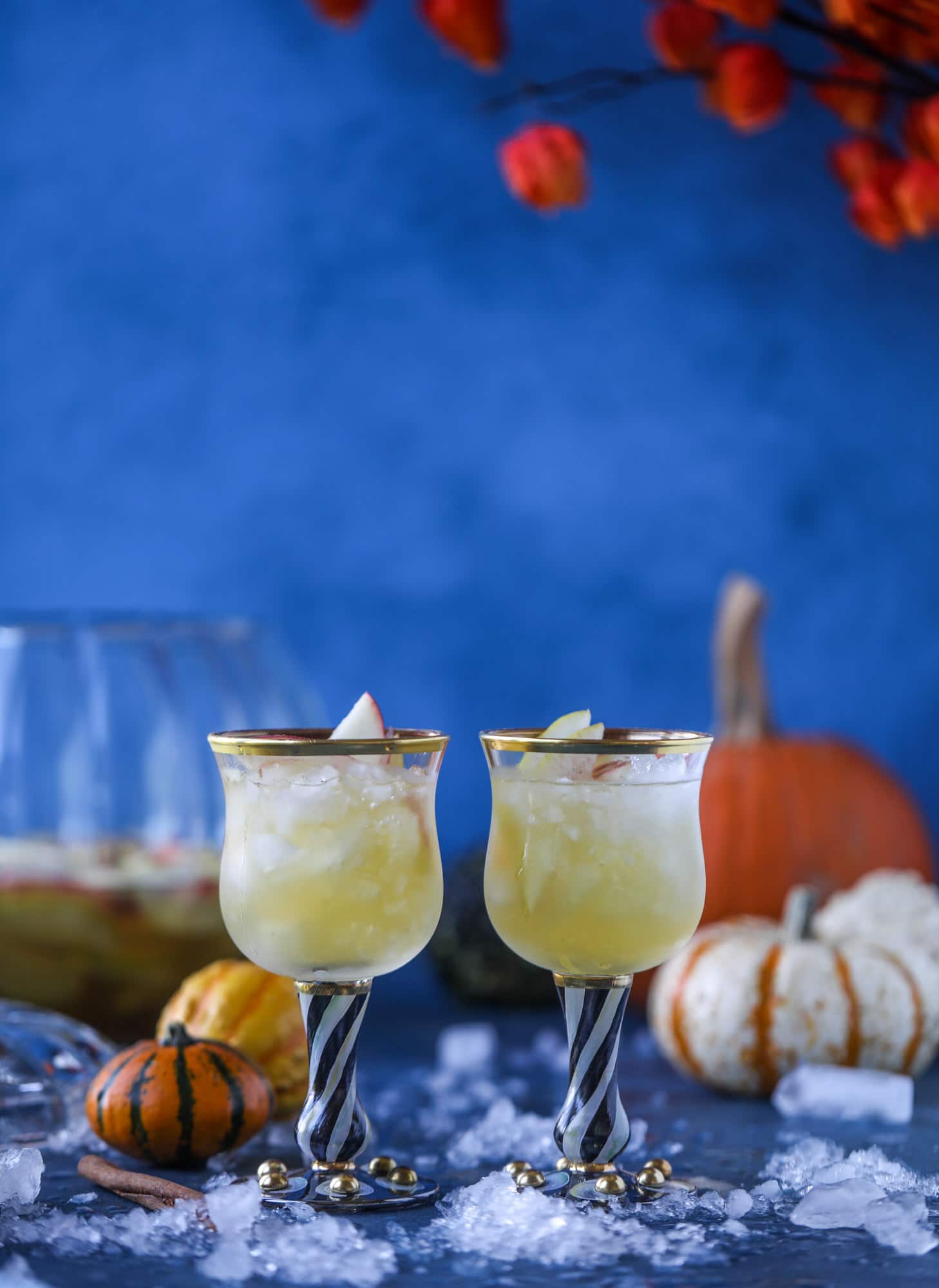 This pumpkin sangria is perfect for the fall and holiday season! A homemade pumpkin pie syrup gives the drink excellent flavor along with bubbles and apple cider and of course, boozy fruit. It's a favorite for Halloween or Thanksgiving! I howsweeteats.com #pumpkin #sangria