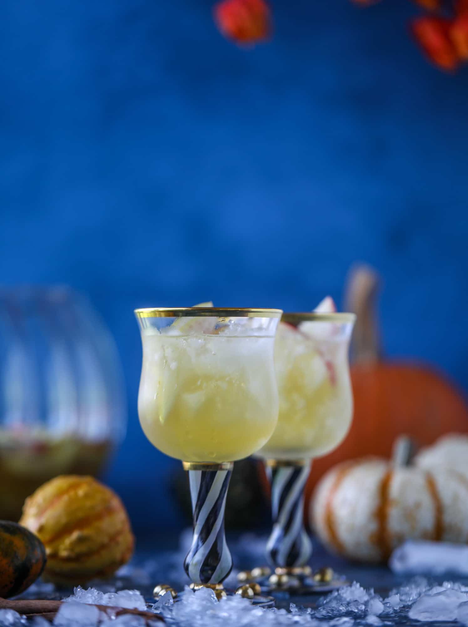 This pumpkin sangria is perfect for the fall and holiday season! A homemade pumpkin pie syrup gives the drink excellent flavor along with bubbles and apple cider and of course, boozy fruit. It's a favorite for Halloween or Thanksgiving! I howsweeteats.com #pumpkin #sangria