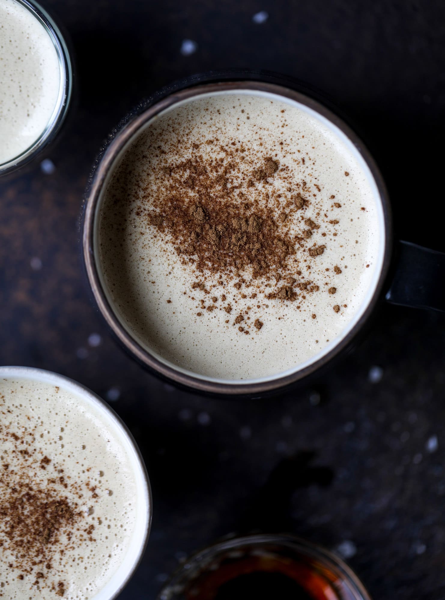 This salted maple power coffee is the perfect creamy pick-me up. Maple syrup, coconut butter and sea salt are blended with hot coffee to make the most deliciously whipped hot, frothy latte-like drink, without any dairy! I howsweeteats.com #coffee #coconutbutter