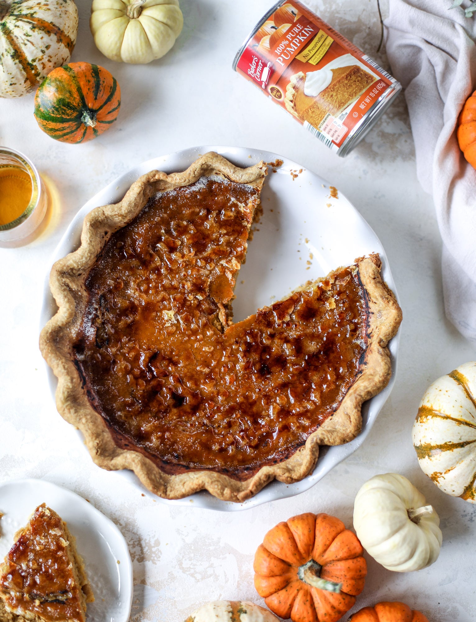 This brûlée pumpkin pie is the best of both worlds in pumpkin desserts! A delicious flaky crust, a creamy pumpkin filling and a crunchy, crispy topping - brûléed sugar right before serving. It's a whole new way to serve pumpkin pie! I howsweeteats.com #pumpkinpie #brulee