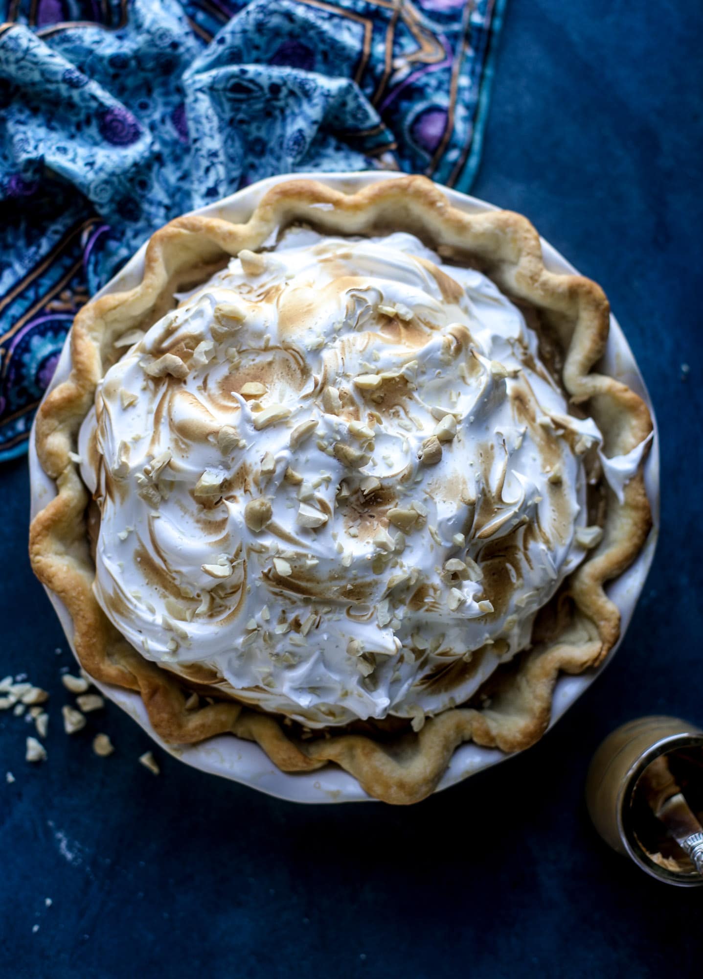 This peanut butter pie recipe is almost identical to the one that my grandmother made when I was a crust. Flaky pastry crust is what makes this pie different, along with a creamy no-bake peanut butter filling that is rich and decadent! I howsweeteats.com #peanutbutter #pie