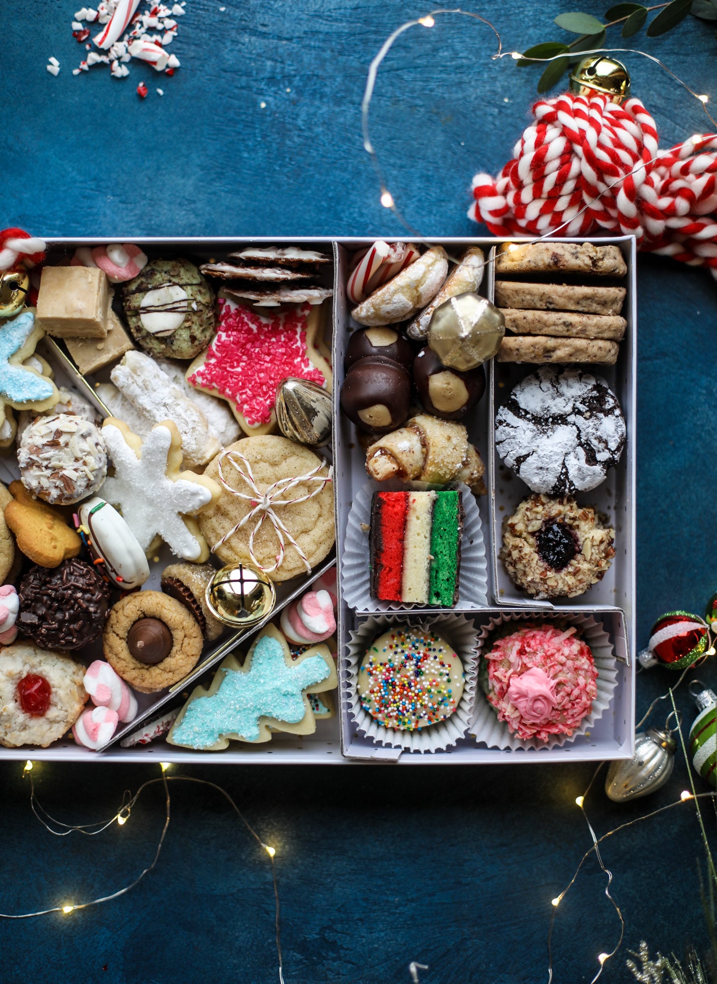 This list is made up of my 2018 best cookies to bake for Christmas and the holiday season! These are tried and true favorites that our friends and family love - ones we put on our cookie trays every single year! I howsweeteats.com #cookies #christmas #box