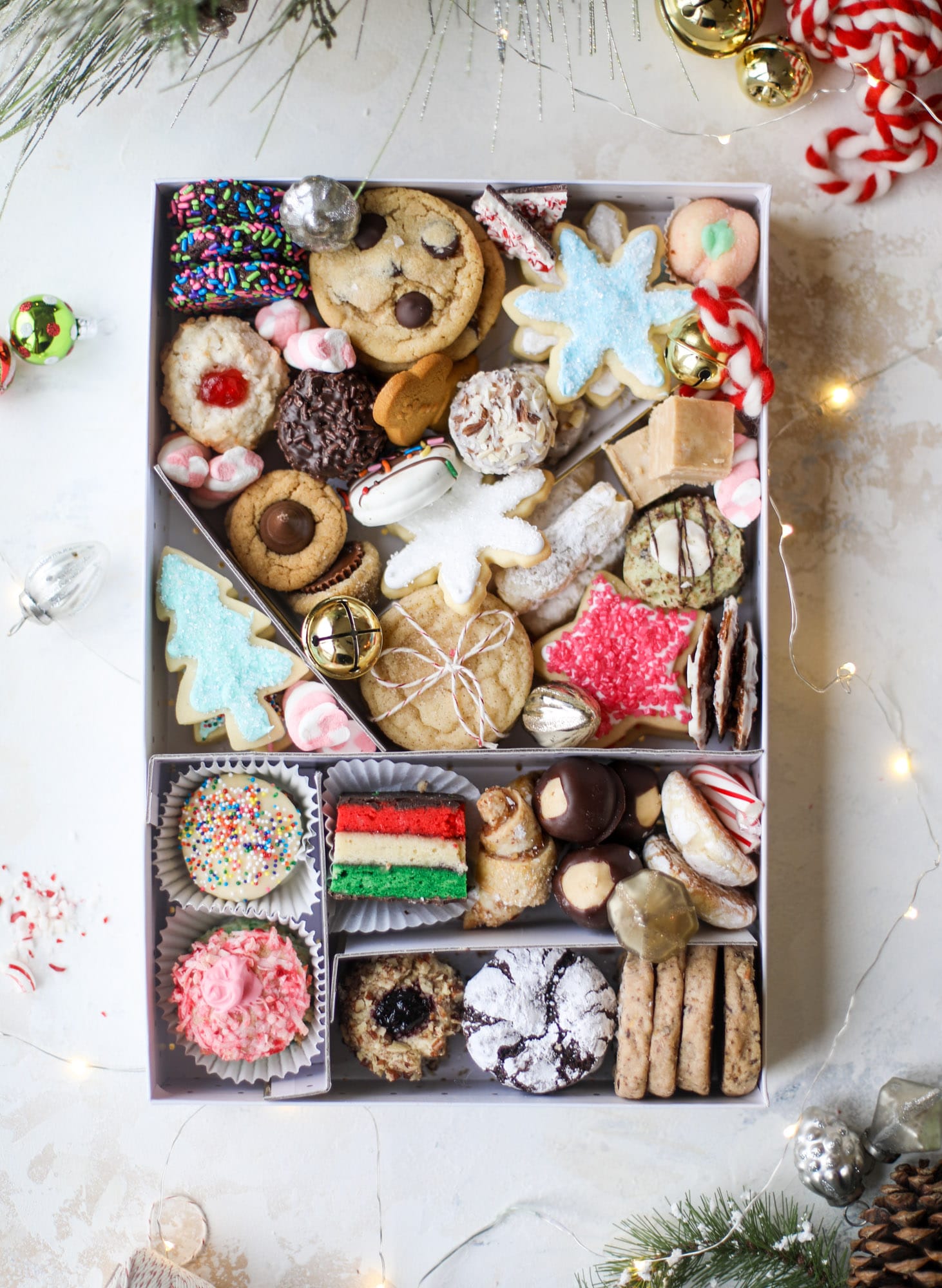 This list is made up of my 2018 best cookies to bake for Christmas and the holiday season! These are tried and true favorites that our friends and family love - ones we put on our cookie trays every single year! I howsweeteats.com #cookies #christmas #box