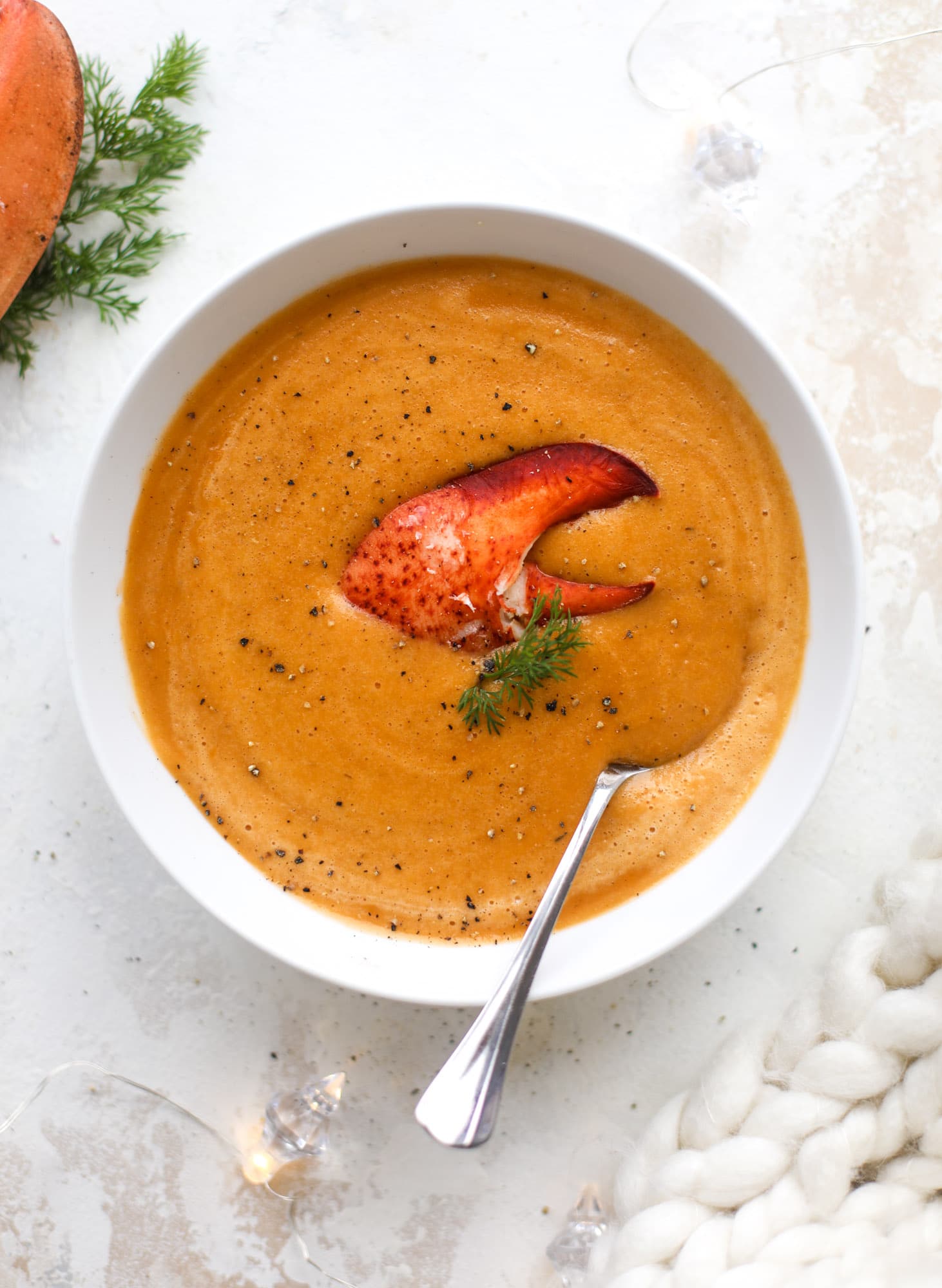 This lobster bisque recipe is delicious, easy and always a crowd pleaser! It's so simple to make at home and it's a rich, decadent treat to serve your family. I also show you how to make a lobster cappuccino, which is lobster bisque with foamed cream! I howsweeteats.com #lobster #bisque