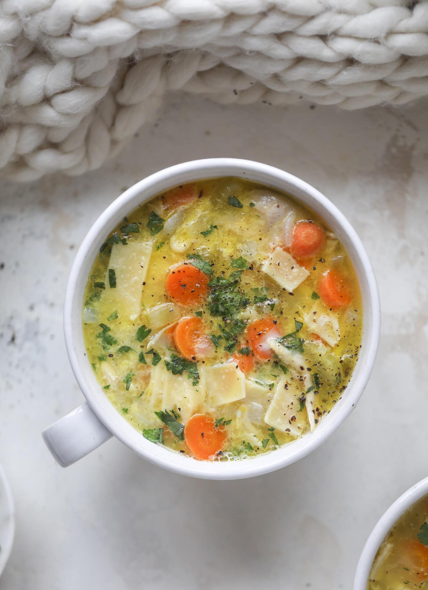 This chicken noodle egg drop soup is the ultimate comfort food! Homemade stock and satisfying ingredients provide the best nourishment and comfort! I howsweeteats.com #chicken #noodlesoup