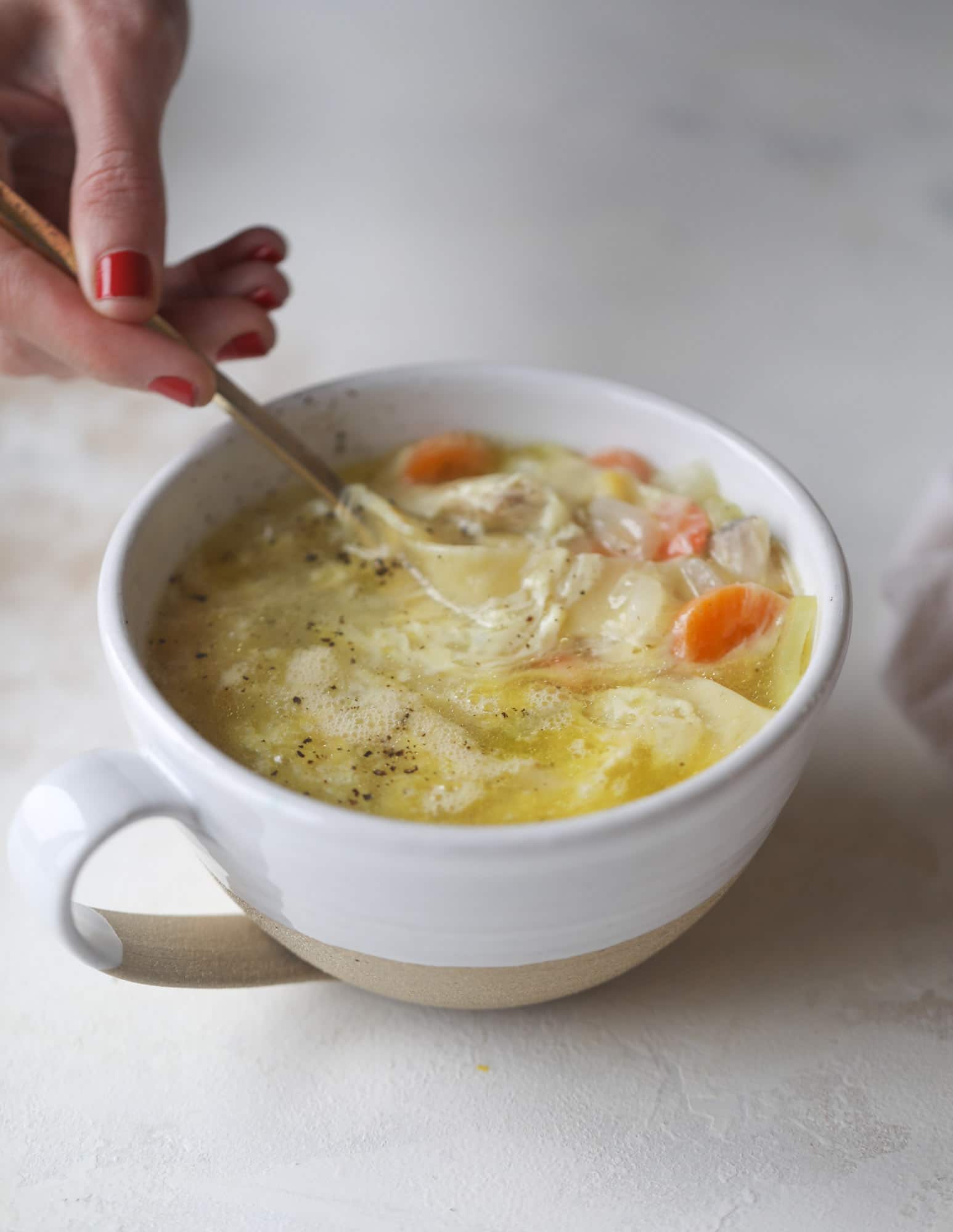 This chicken noodle egg drop soup is the ultimate comfort food! Homemade stock and satisfying ingredients provide the best nourishment and comfort! I howsweeteats.com #chicken #noodlesoup