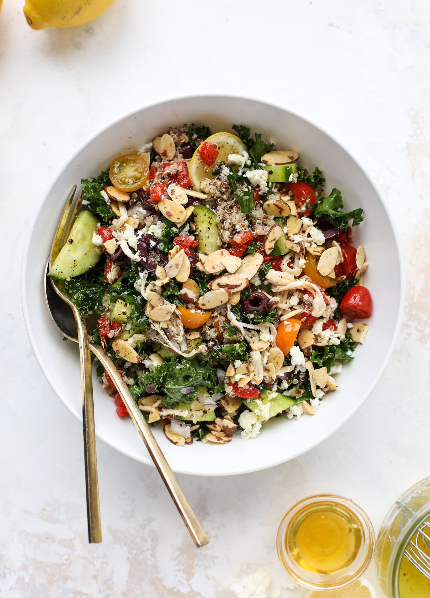 This mediterranean kale and quinoa salad is a copycat for the delicious Panera Bread Modern Greek Salad with Chicken. Super easy and satisfying! I howsweeteats.com #mediterranean #kalesalad