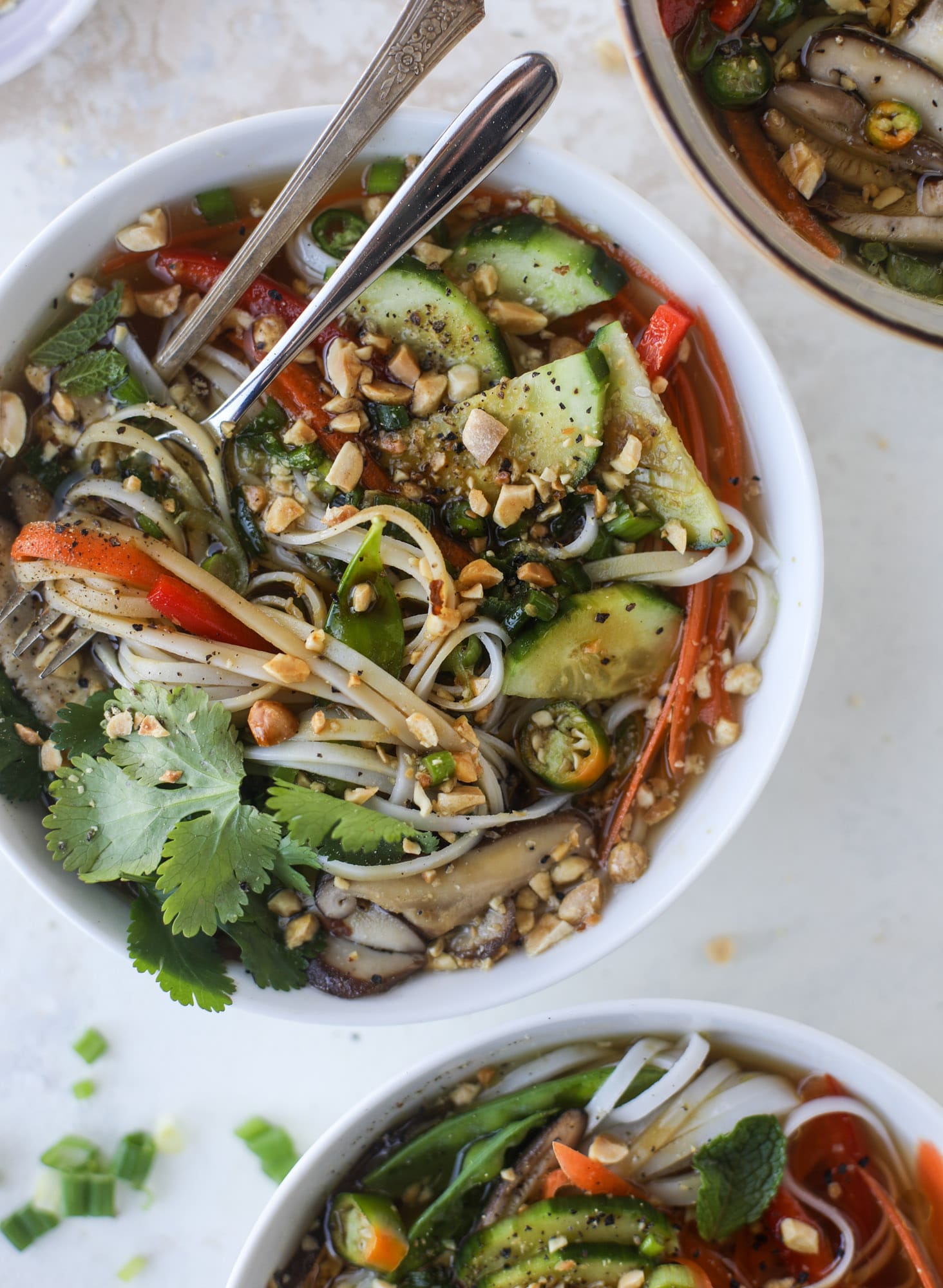 Ginger scallion noodle bowls are a flavorful, comforting vegetarian meal that can be customized to include any veggies you love! I howsweeteats.com #noodle #bowls
