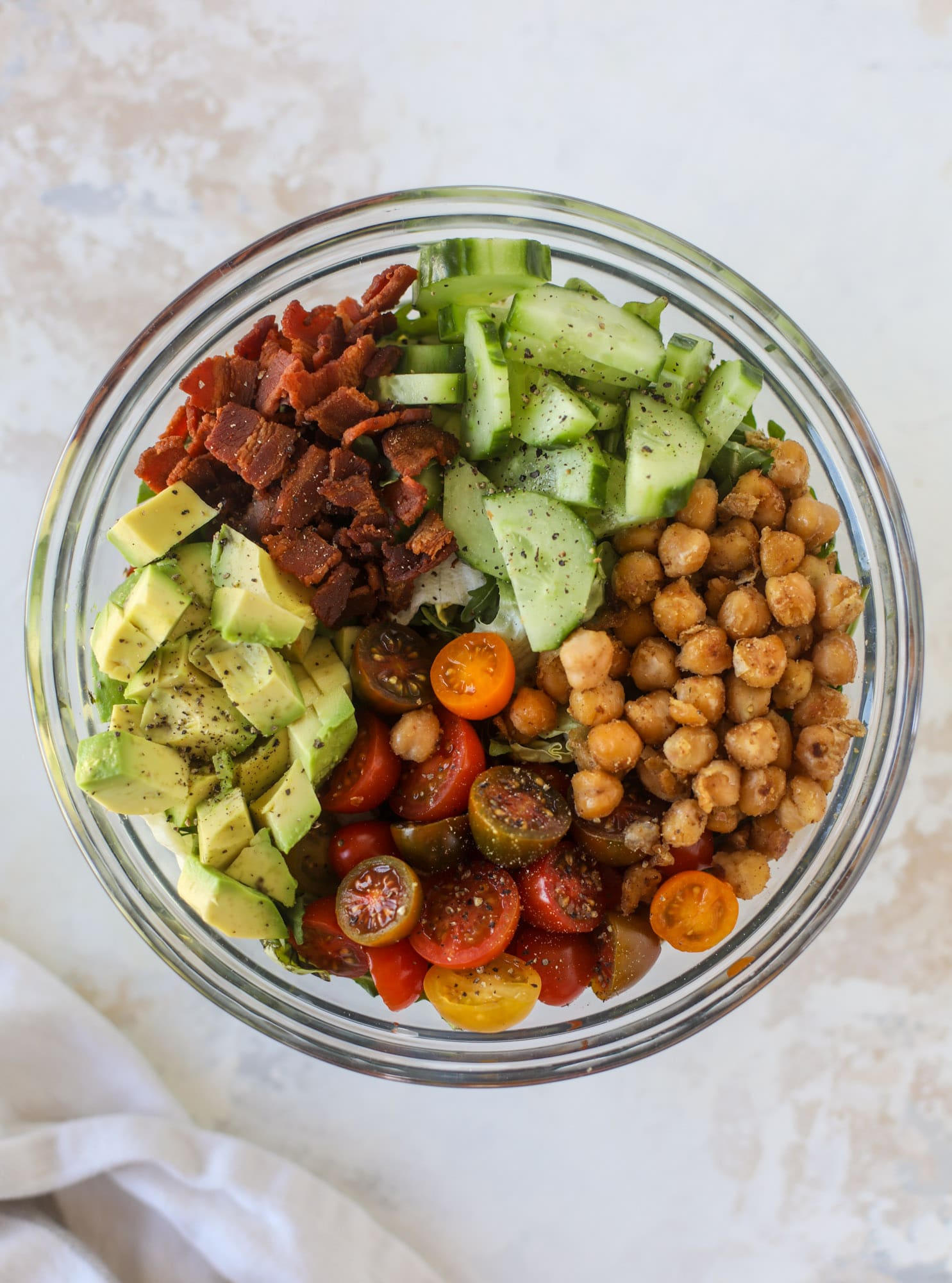 The chickpea bacon ranch salad has a ton of crispy, crunchy texture and flavor. It's satisfying and super easy to prep ahead of time too! I howsweeteats.com #chickpea #salad