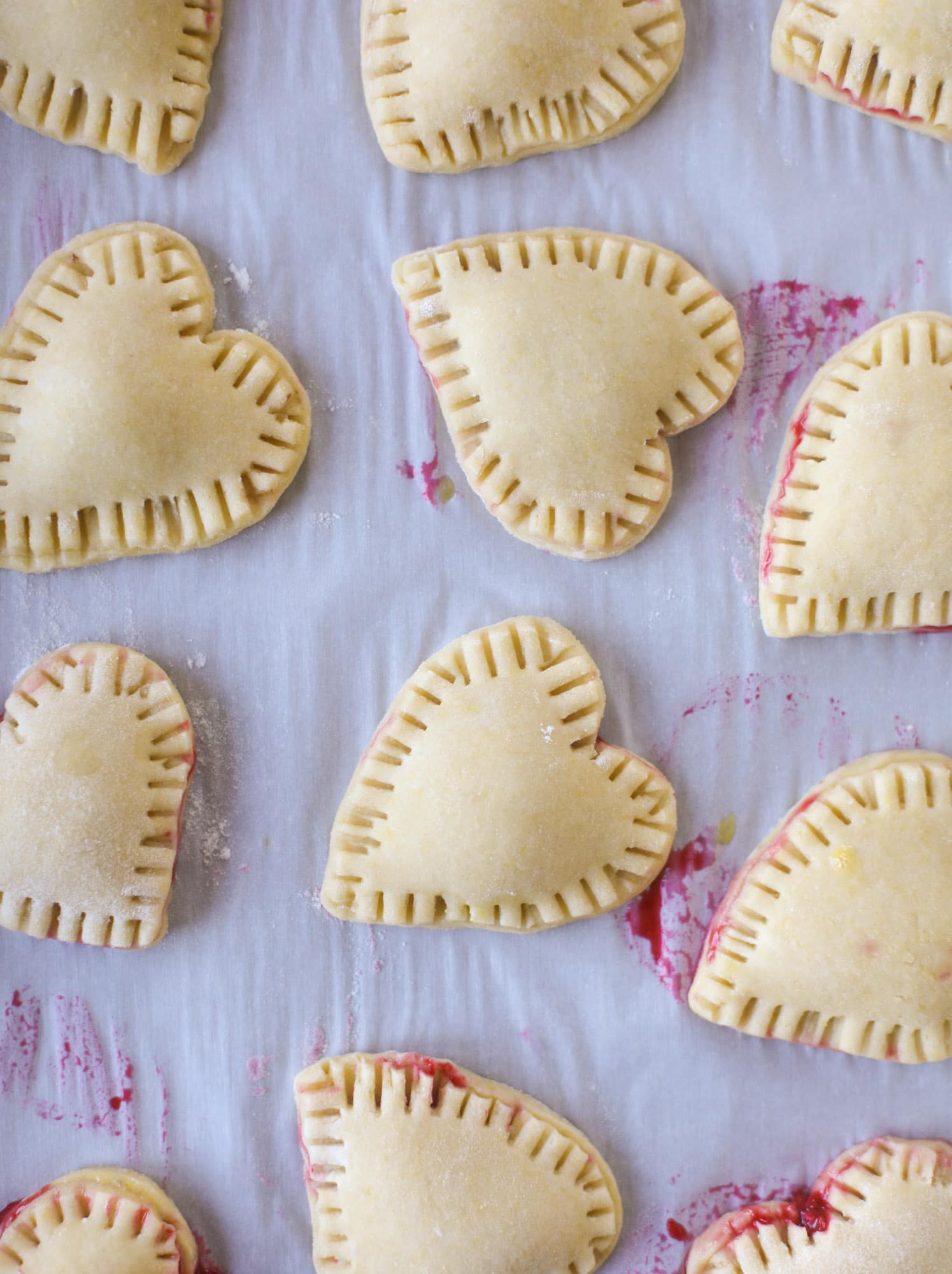 These adorable mini heart pies are filled with a homemade raspberry compote and creamy, chocolatey nutella. So fun and easy to make! I howsweeteats.com #heart #pie