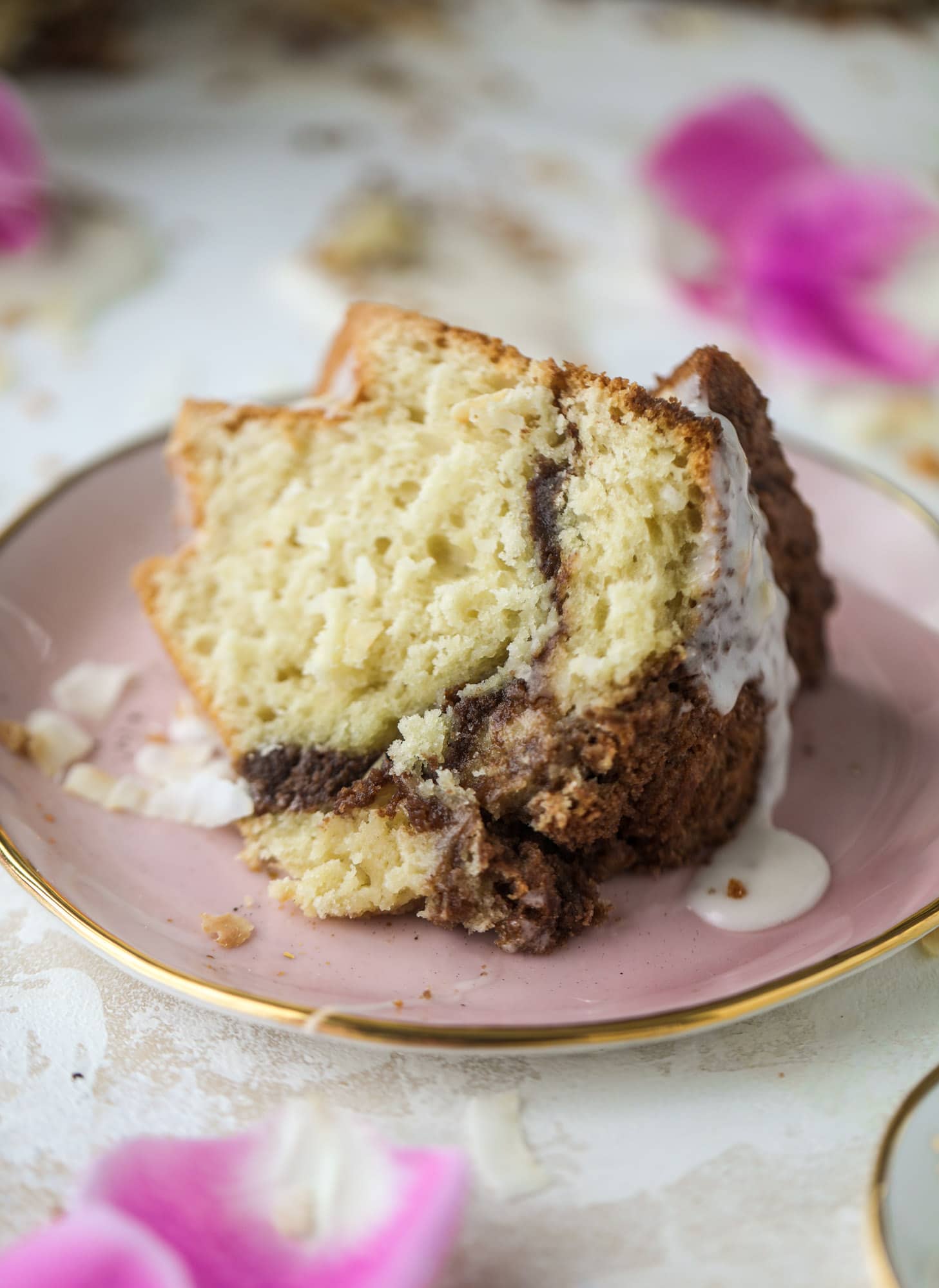 Make breakfast and brunch better with coconut coffee cake! Tender coconut cake with a cocoa sugar streusel and a coconut glaze. To die for!