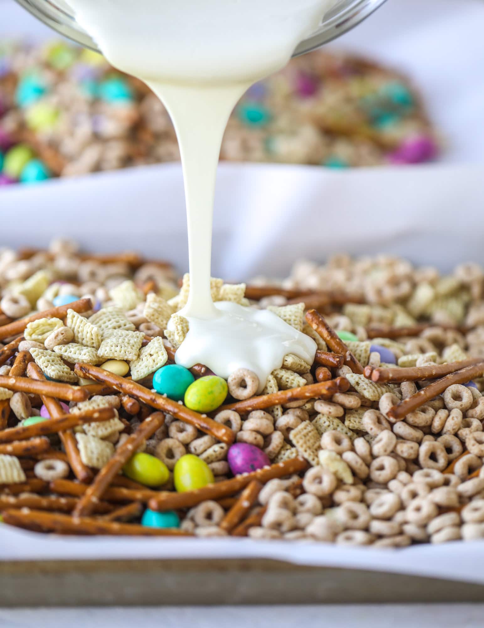 white chocolate drizzle on easter snack mix