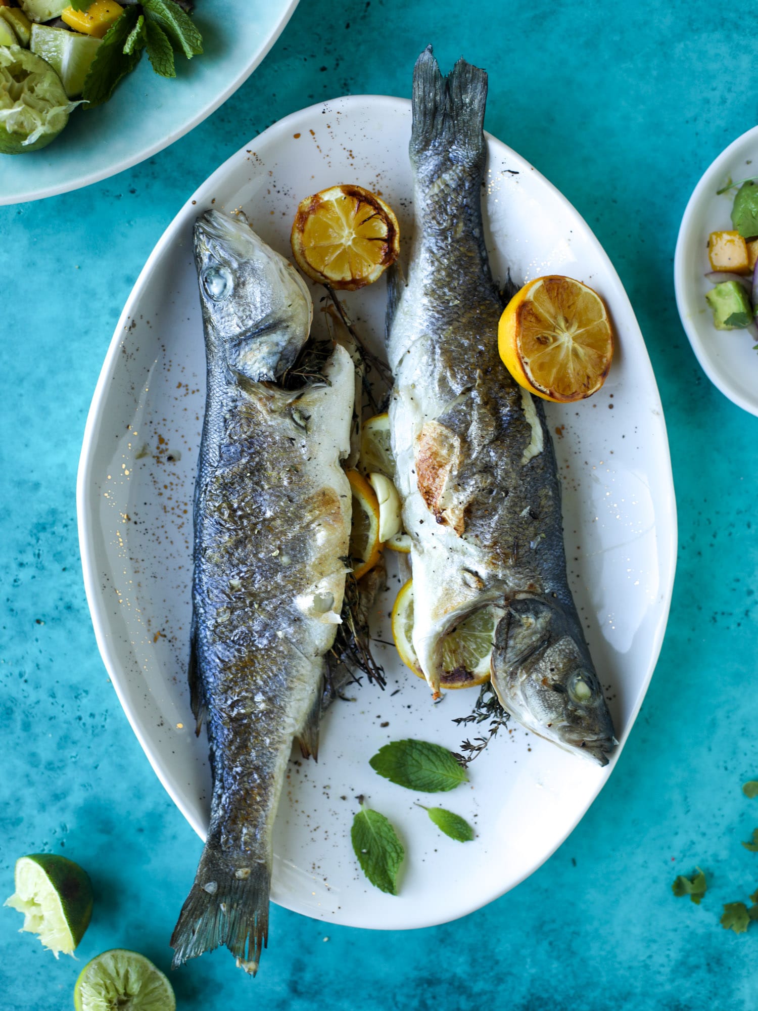 Grilled whole fish is easier than it looks! Try this recipe for the butteriest, most flavorful grilled branzino paired with an avocado mango salad.