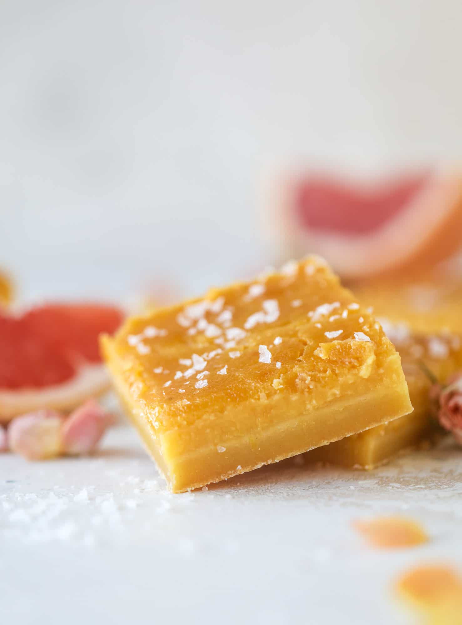 These salted citrus bars are made of both grapefruit and lemon curd on a buttery shortbread crust. Top with flaked sea salt for the perfect bite!