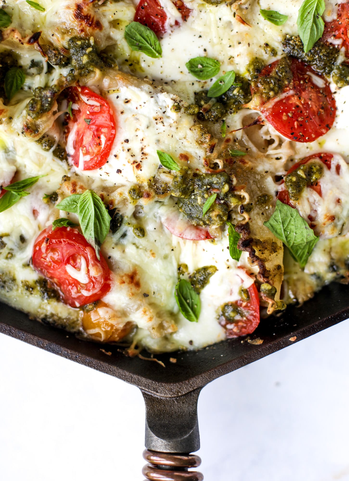 Quick caprese skillet lasagna is a lovely and comforting summer meal! Lots of fresh basil, ripe tomatoes and cheese bring this easy weeknight meal together.