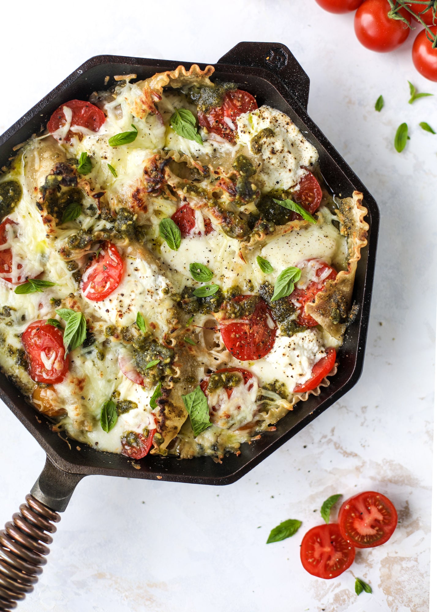 Quick caprese skillet lasagna is a lovely and comforting summer meal! Lots of fresh basil, ripe tomatoes and cheese bring this easy weeknight meal together.