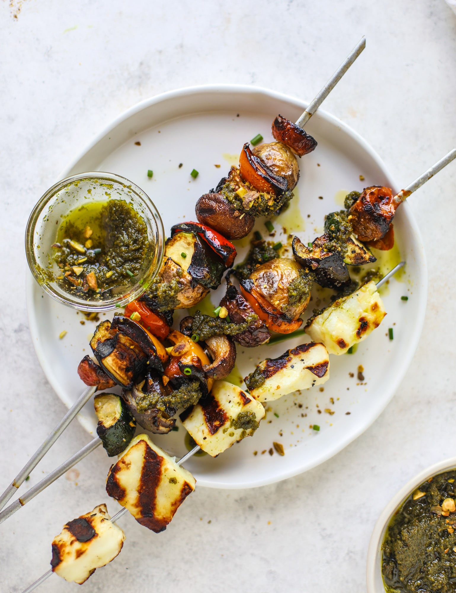 My all time favorite grilled vegetable skewers served with grilled halloumi cheese and pistachio pesto! Makes the best summer meal ever.