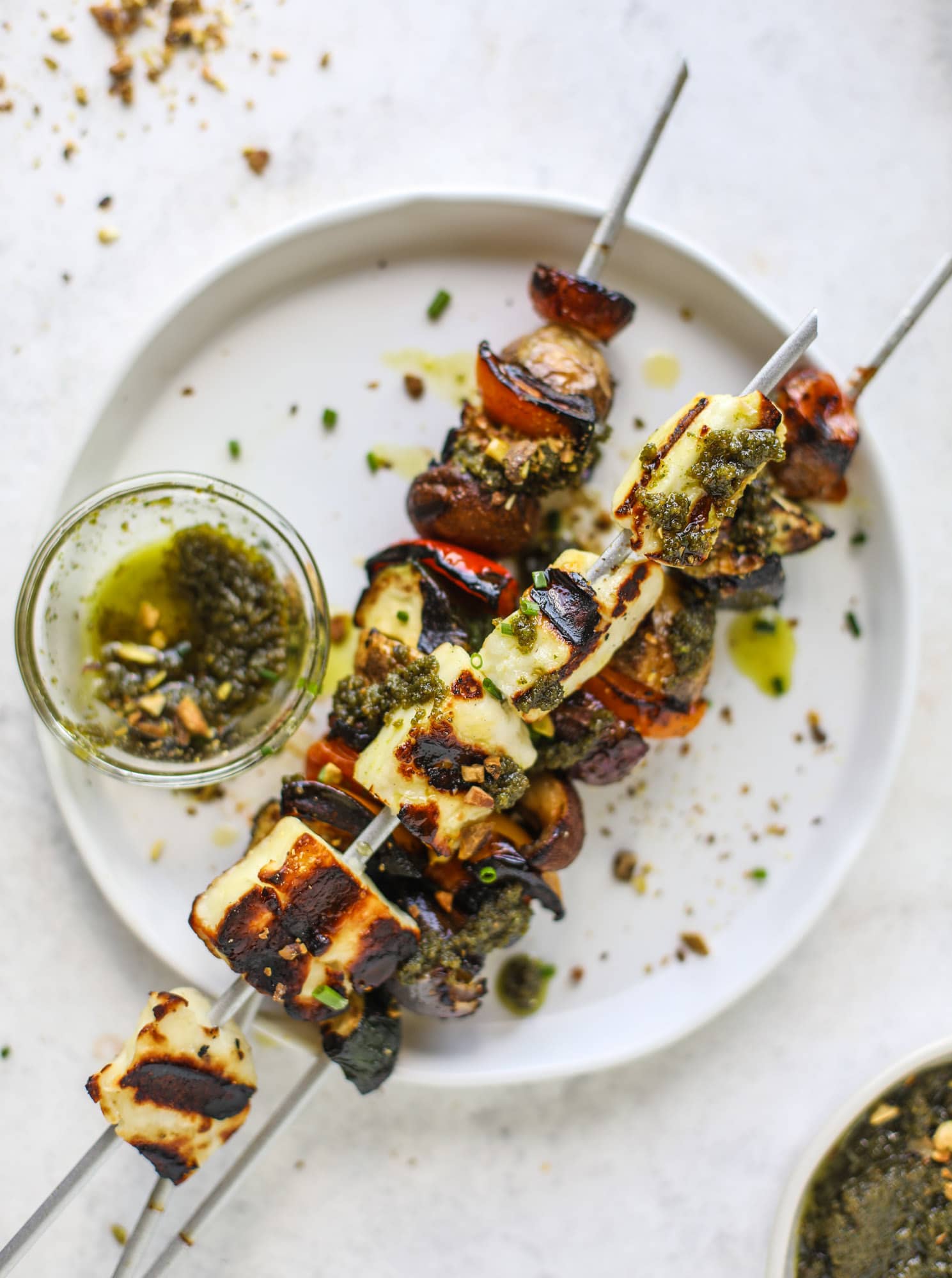 My all time favorite grilled vegetable skewers served with grilled halloumi cheese and pistachio pesto! Makes the best summer meal ever.