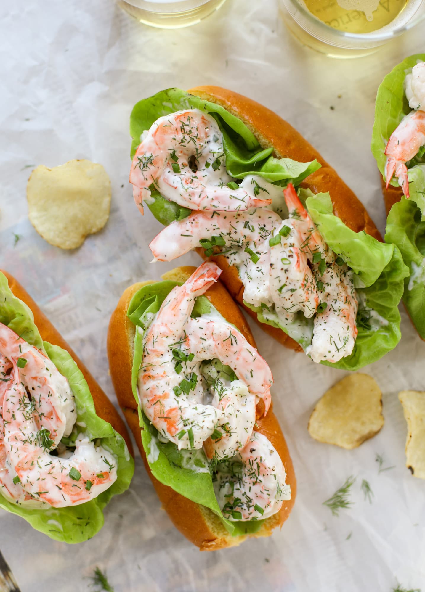 These shrimp salad rolls are my go-to simple, easy, no-cook dinner for hot summer day. Serve with pickles, potato chips and a spritz of lemon!