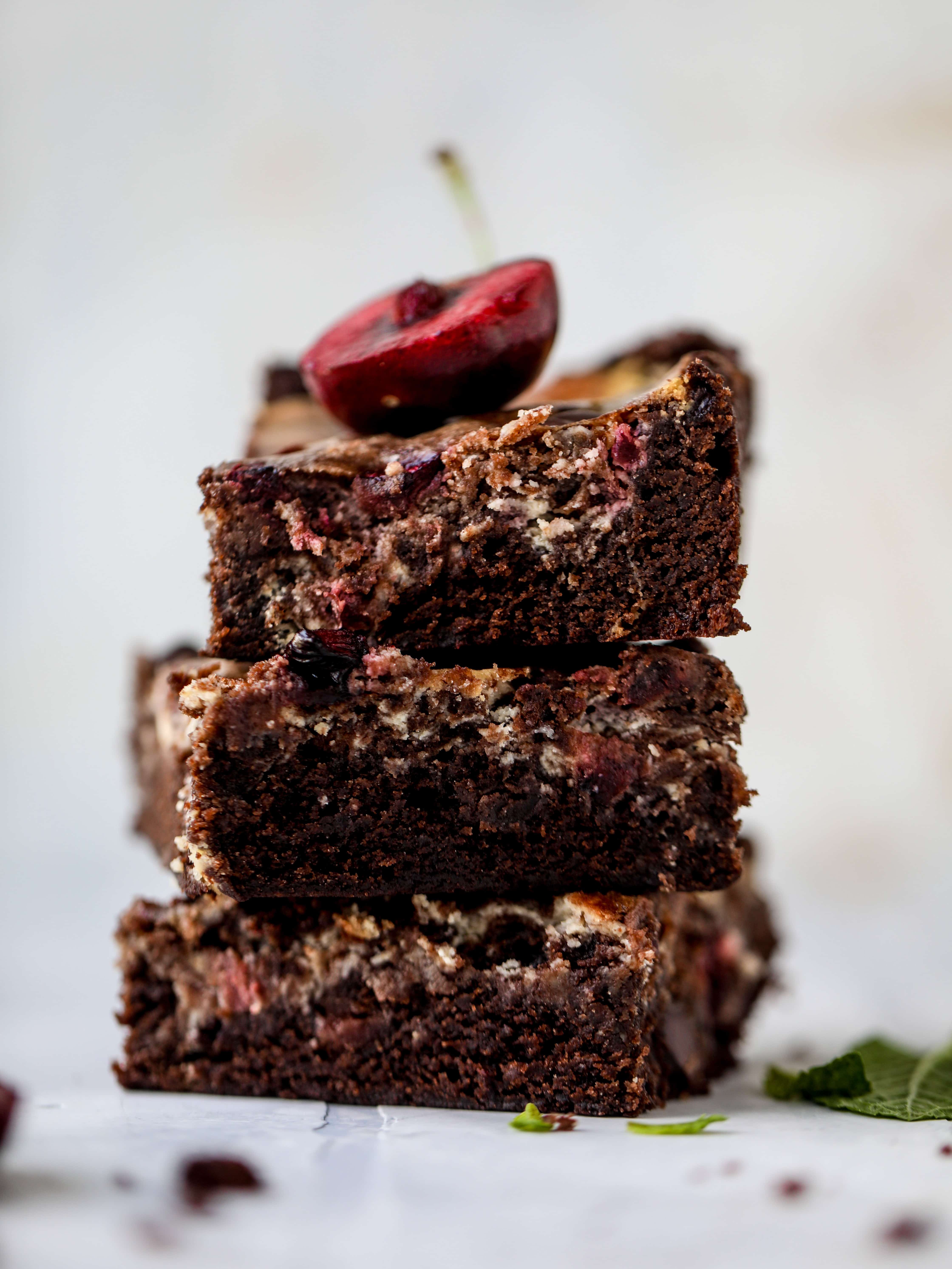 These cherry cheesecake swirl brownies are super rich and fudgy, filled with dark chocolate and fresh cherry, topped with a cherry cheesecake swirl.