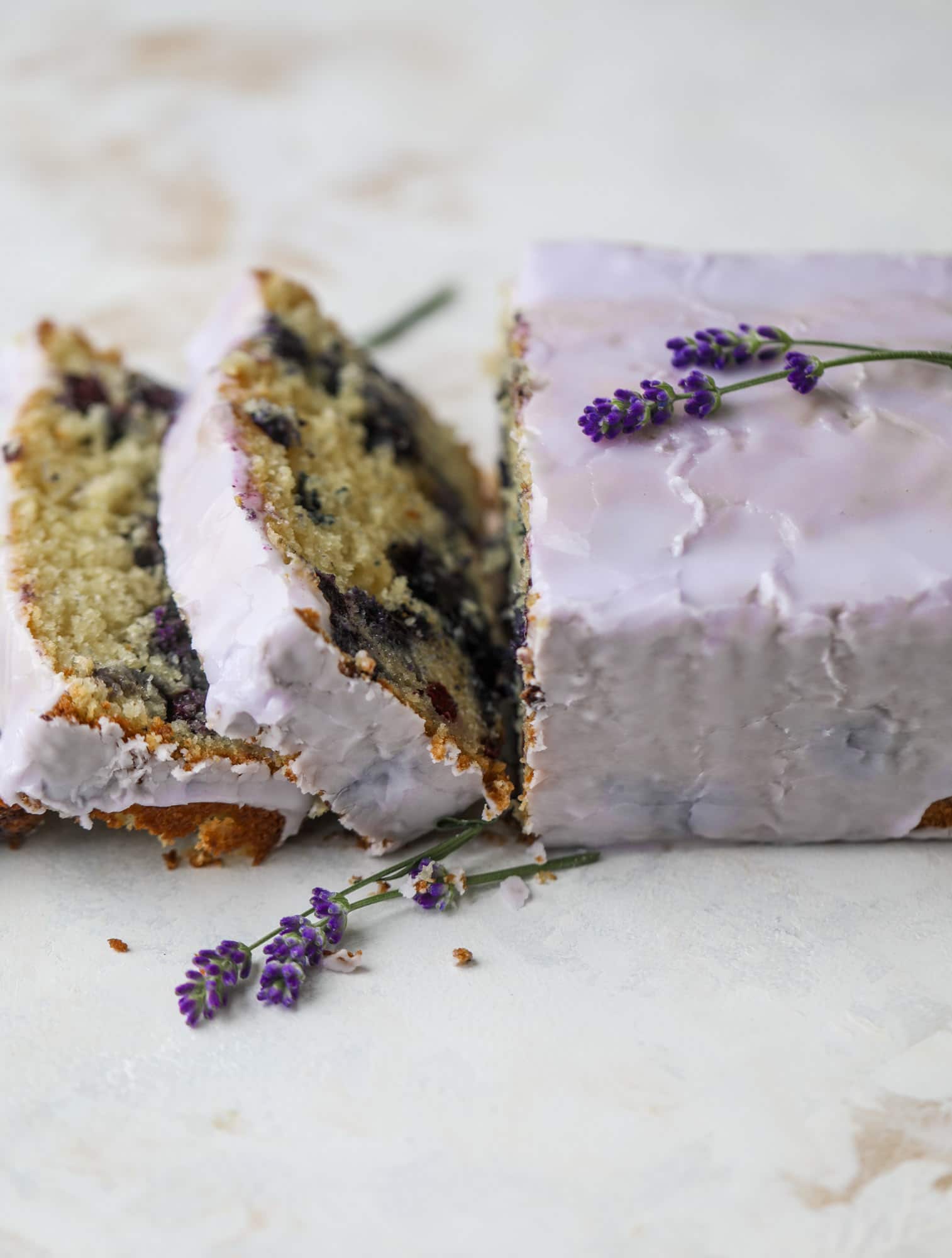 This lovely blueberry ricotta cake is covered in a lavender glaze and the perfect recipe for blueberry season! It's rich and light and super flavorful.