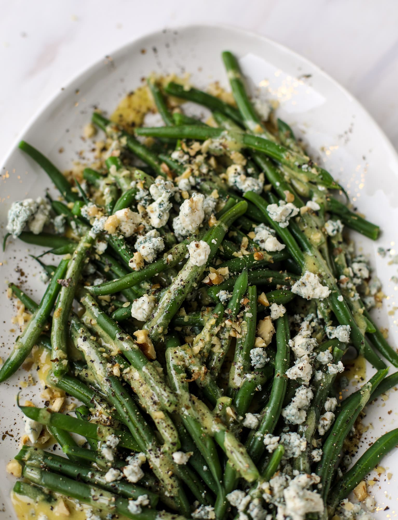 This fresh green bean salad is the ultimate summer side dish. Crisp green beans, creamy blue cheese, chopped walnuts and a dijon dressing. It's beyond!